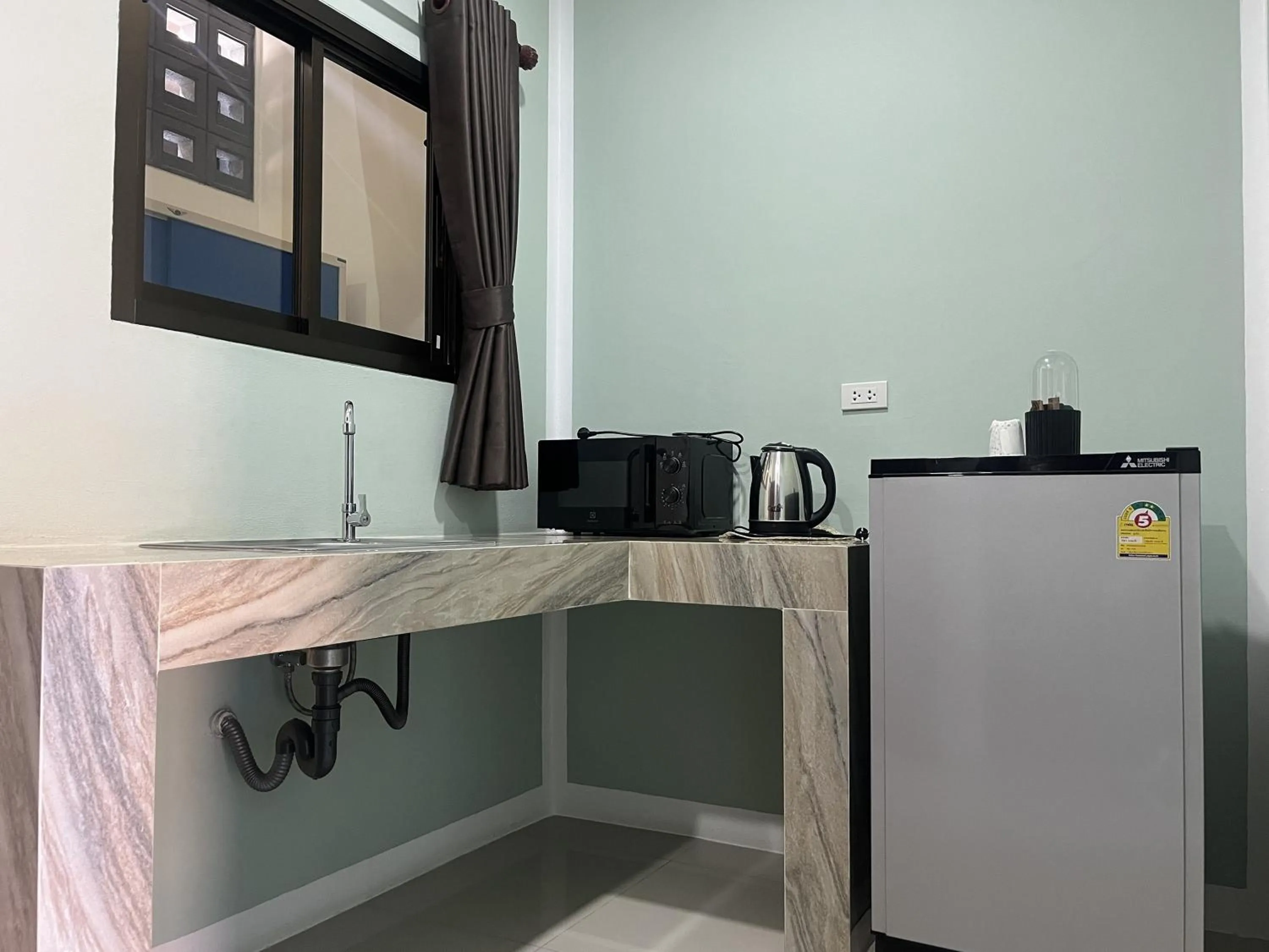 kitchen in J & Ariya Hotel Near Samui Airport and Koh Phangan Pier