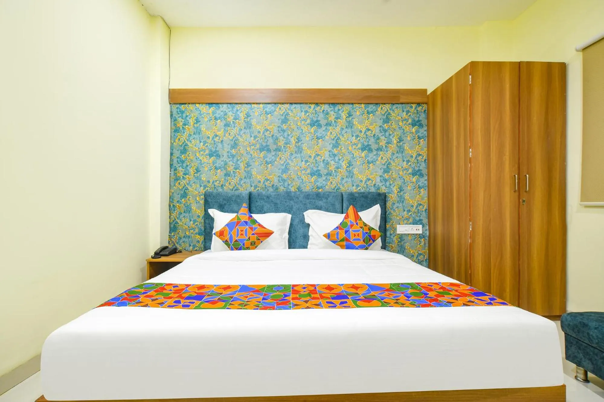 Bed in FabHotel Grand Giriraj