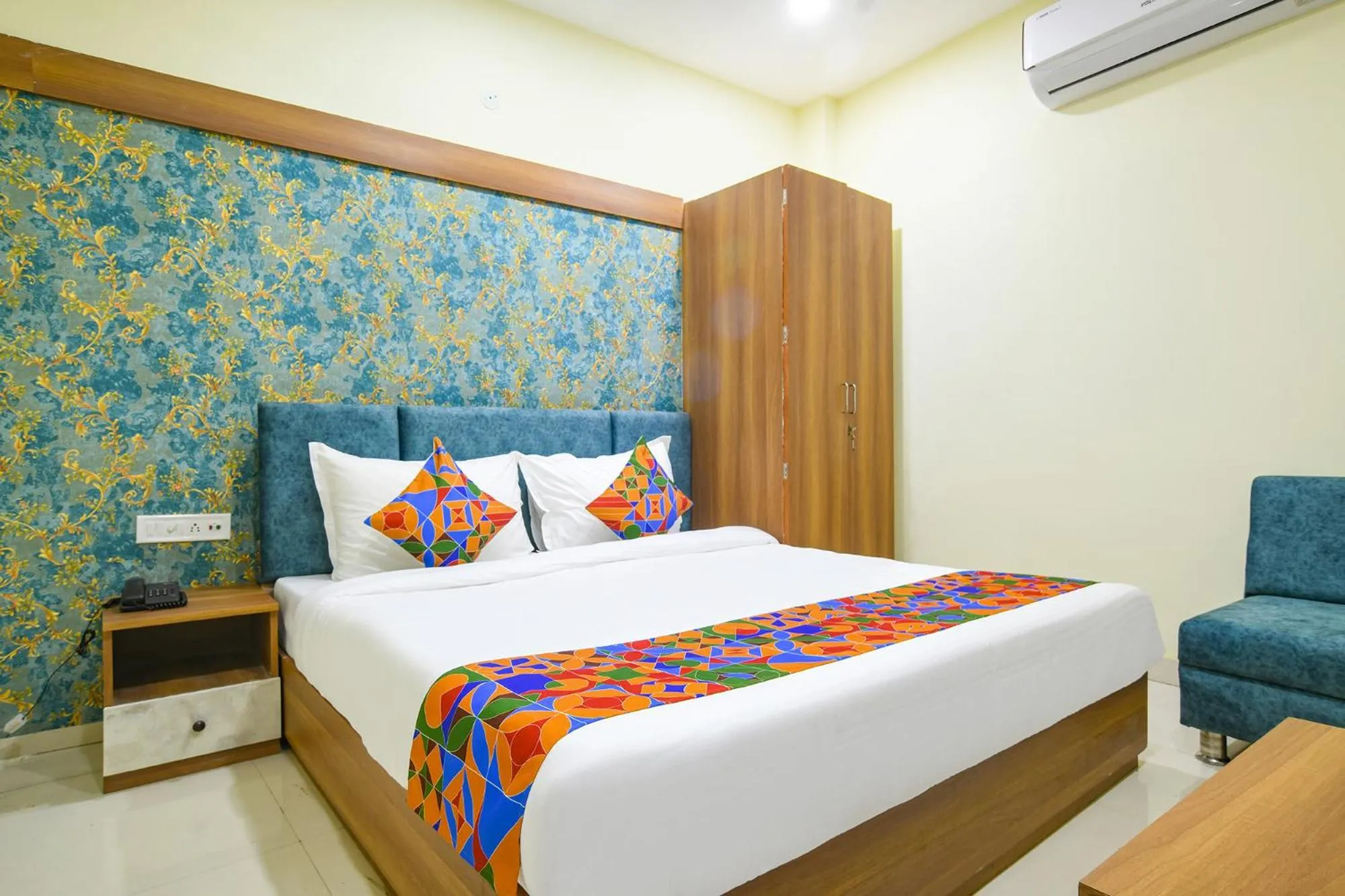 Bed in FabHotel Grand Giriraj