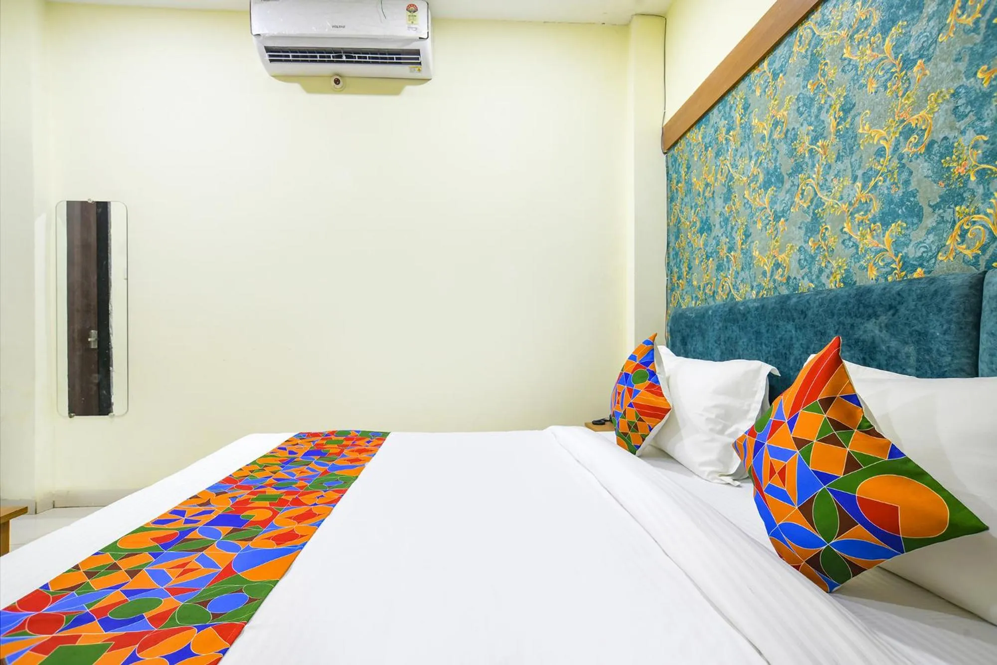 Bed in FabHotel Grand Giriraj