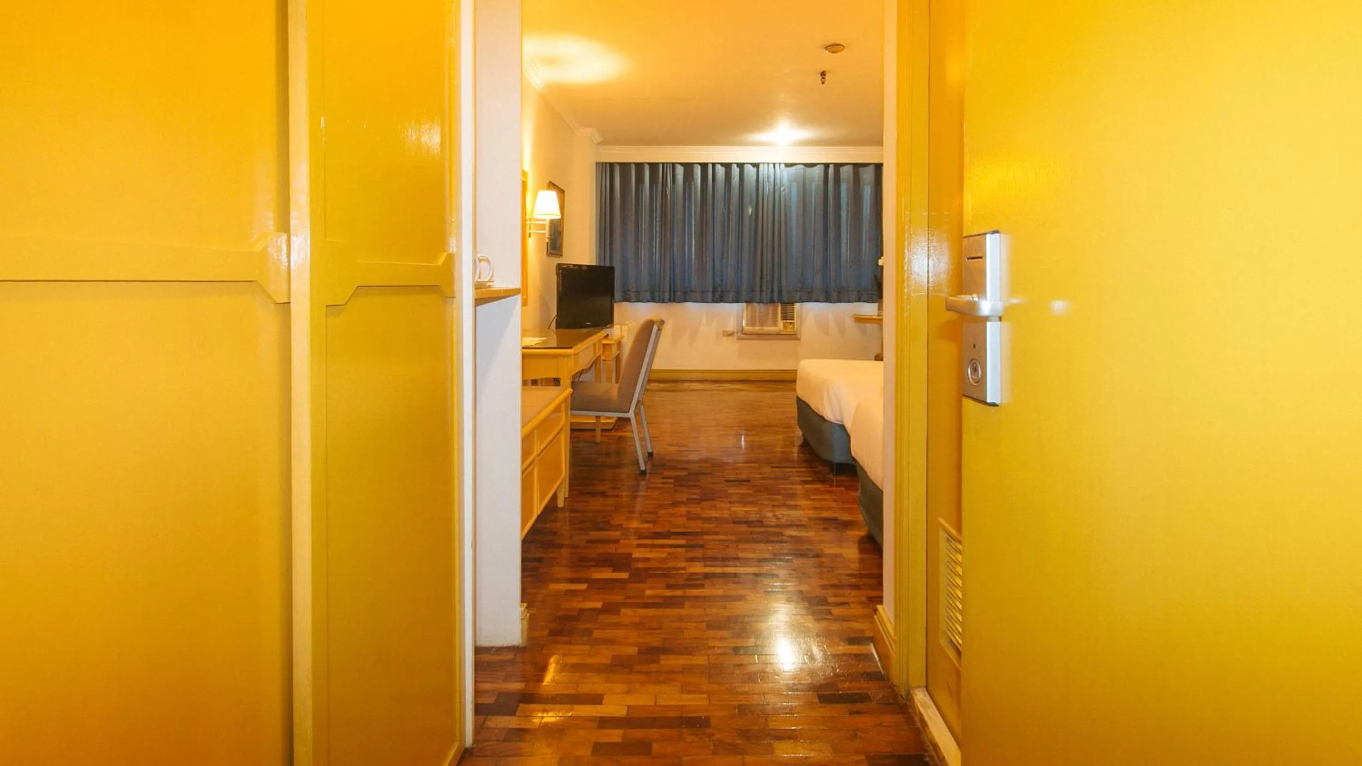 Photo of the whole room, Bed in Aloha Hotel Roxas Boulevard Manila