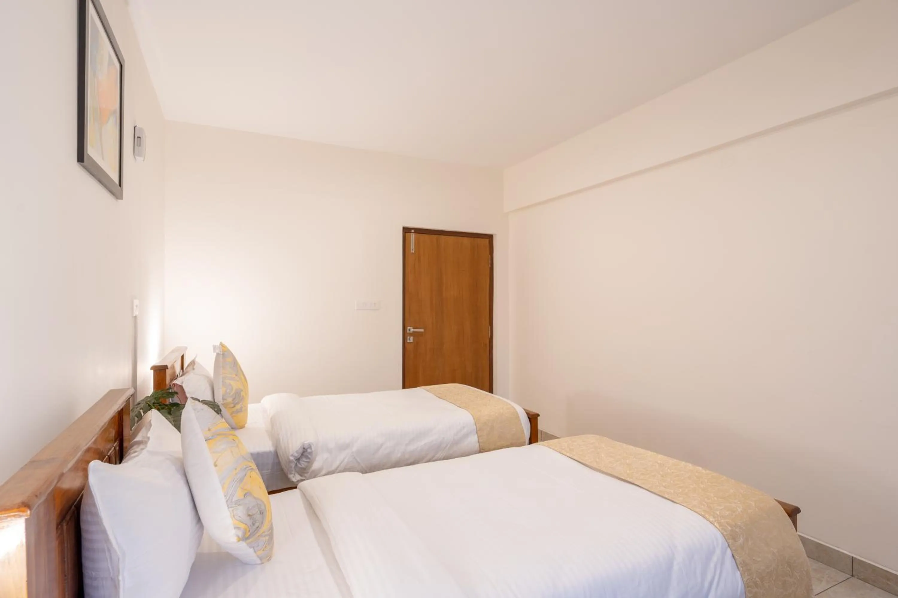 Bed in The Silver Chimes Suites