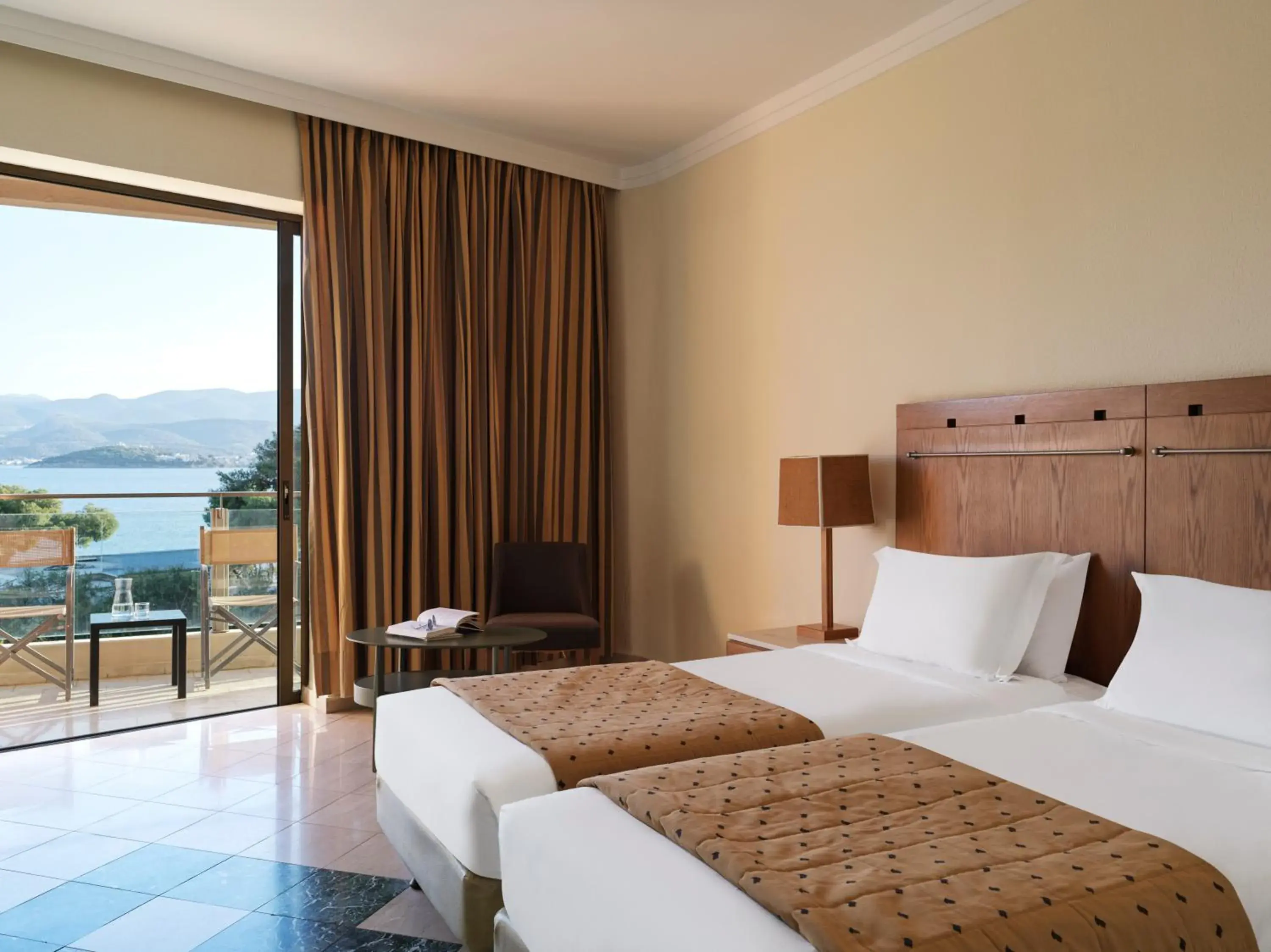 Balcony/Terrace, Bed in Kalamaki Beach Resort Balcony/Terrace, Bed in Kalamaki Beach Resort