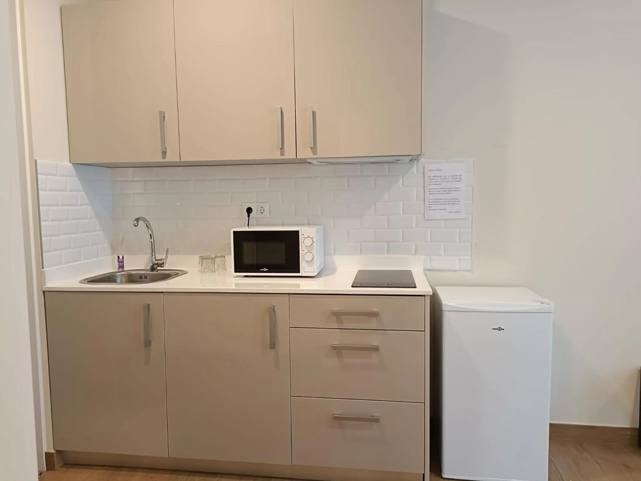 Kitchen or kitchenette in Apartahotel Golden Alcalá