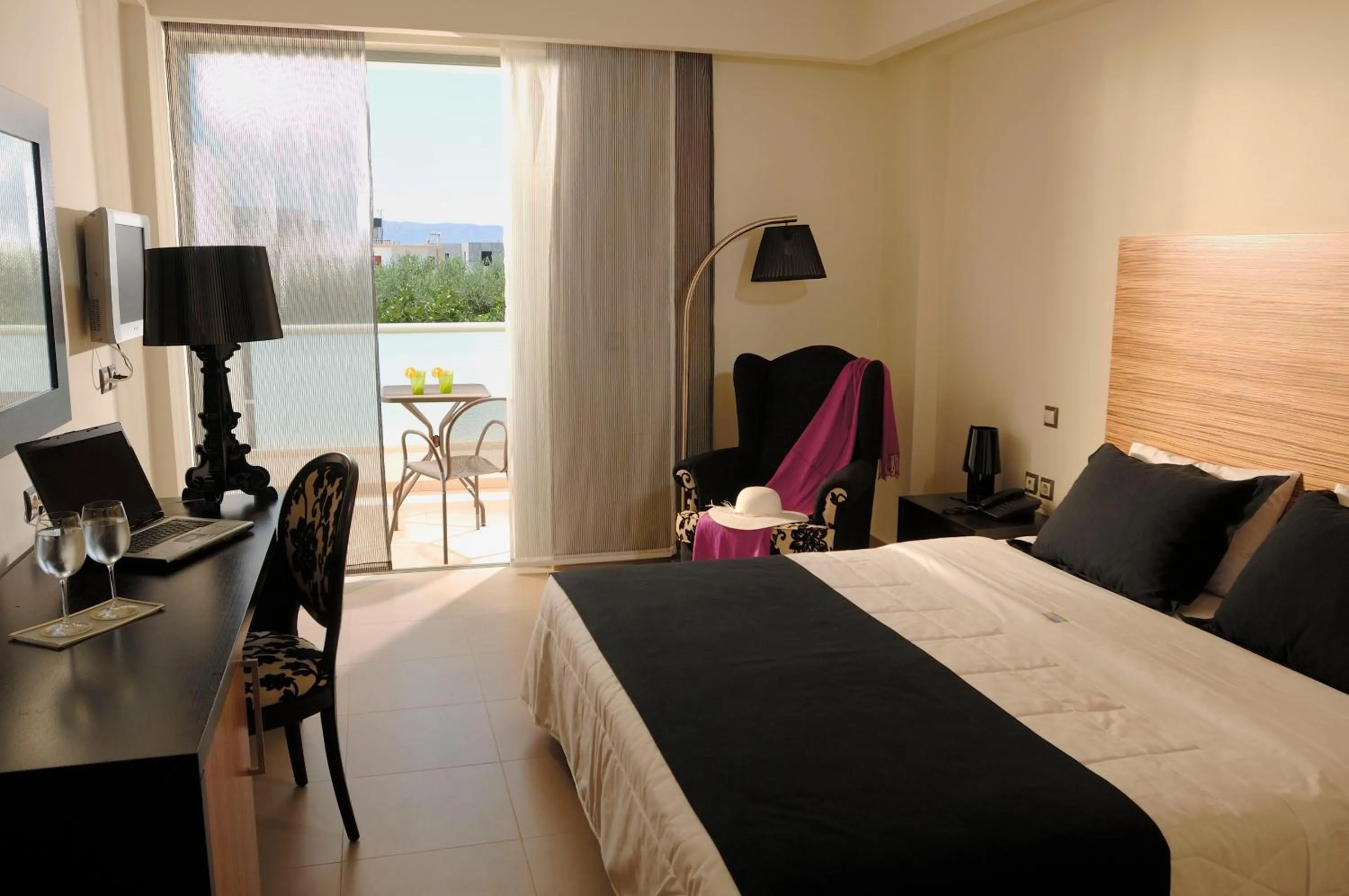 Bed in Angela Suites Boutique Hotel