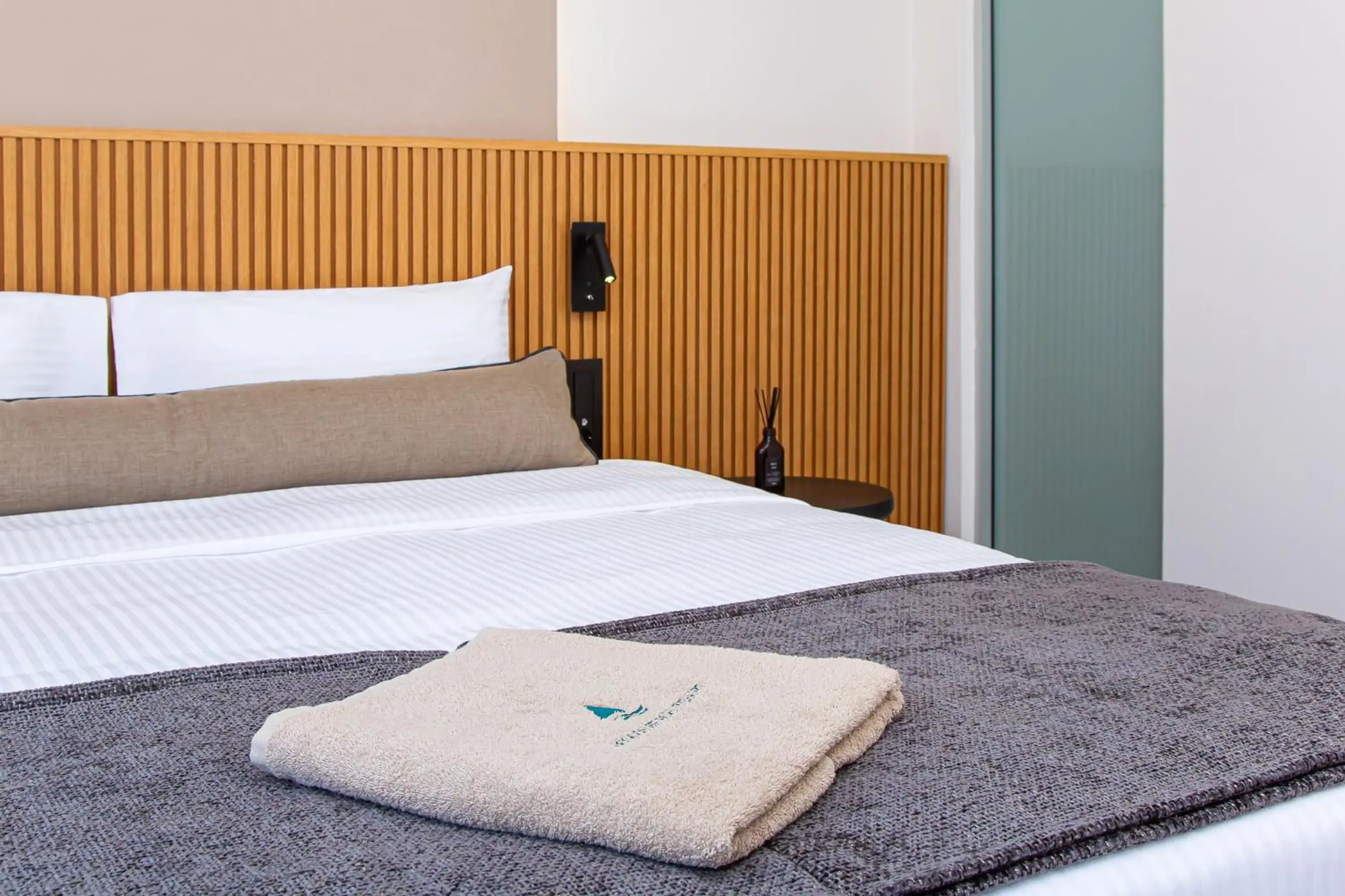 Bed in Aeolos Beach Resort Bed in Aeolos Beach Resort