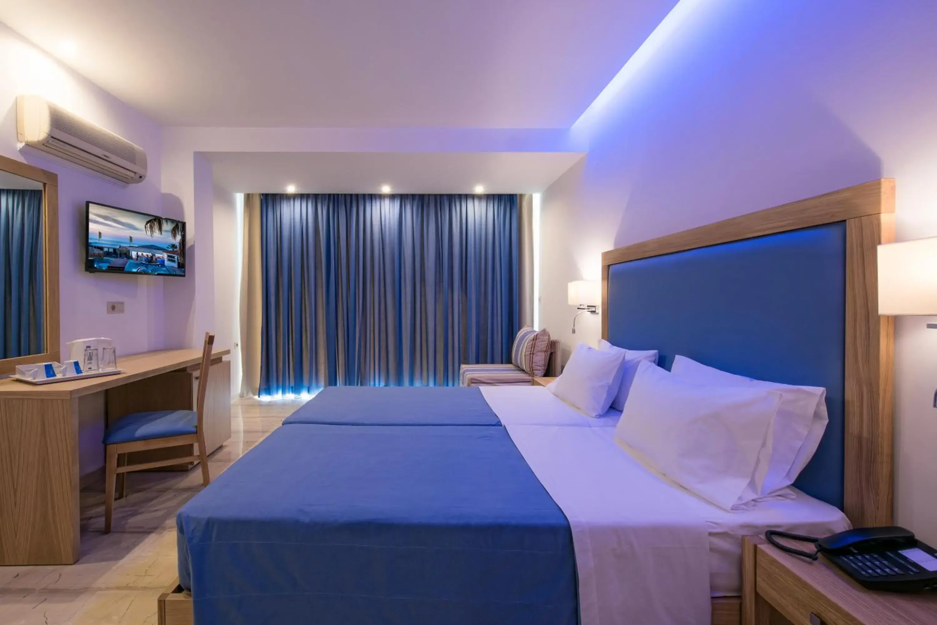 Bed in Aeolos Beach Resort Bed in Aeolos Beach Resort