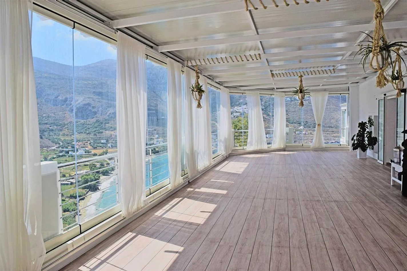 Communal lounge/ TV room in Aegialis Hotel & Spa