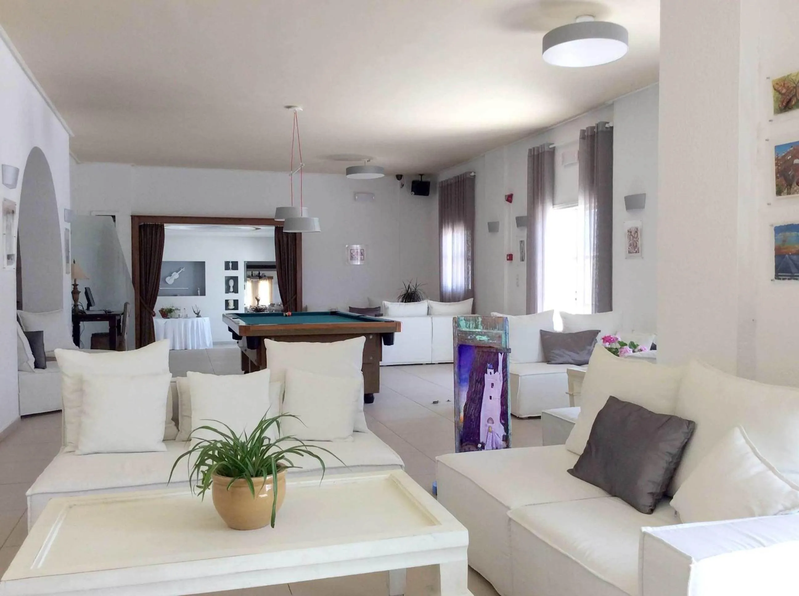 Communal lounge/ TV room in Aegialis Hotel & Spa