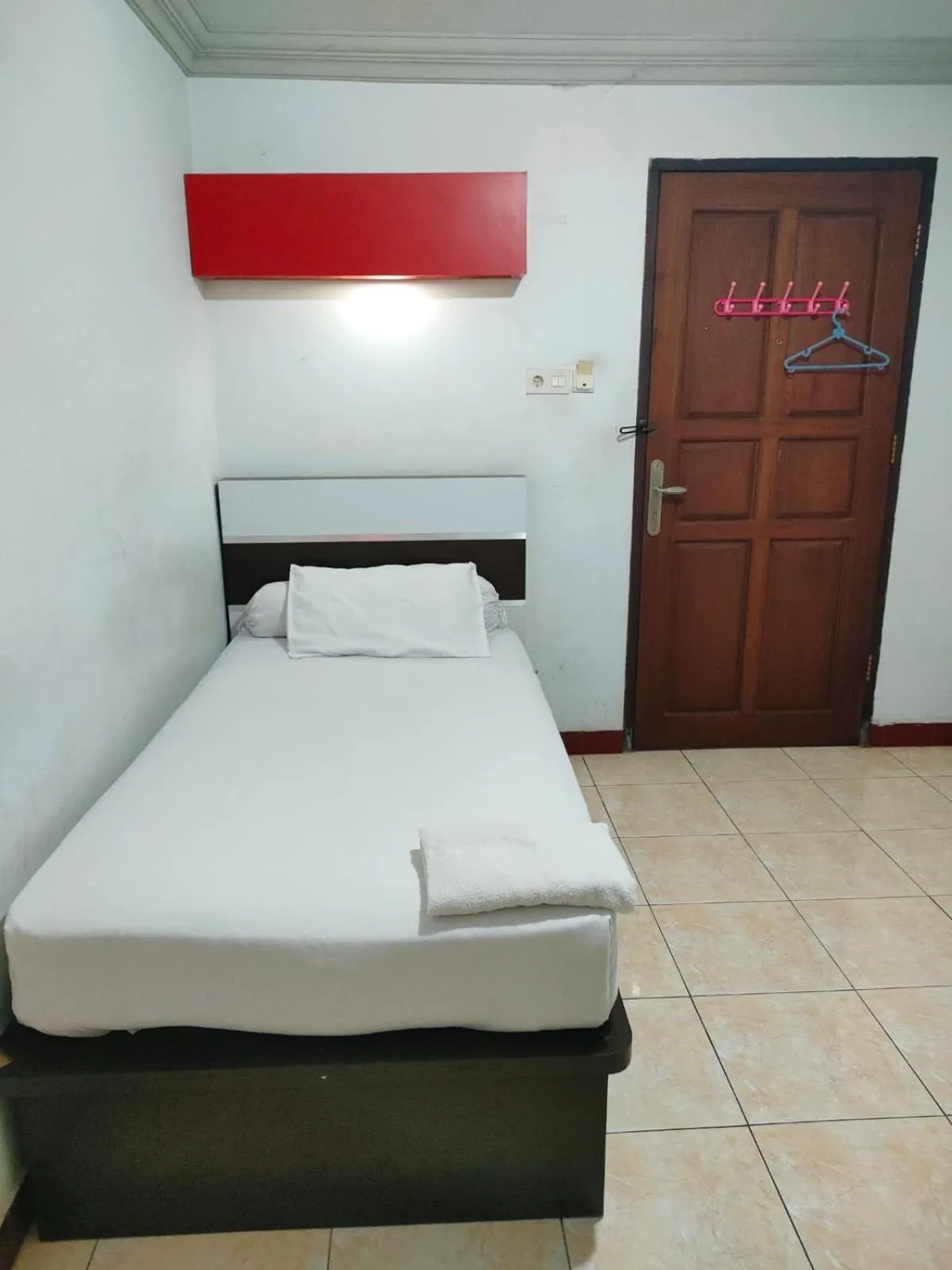 Bed in Hotel Riverside Manado