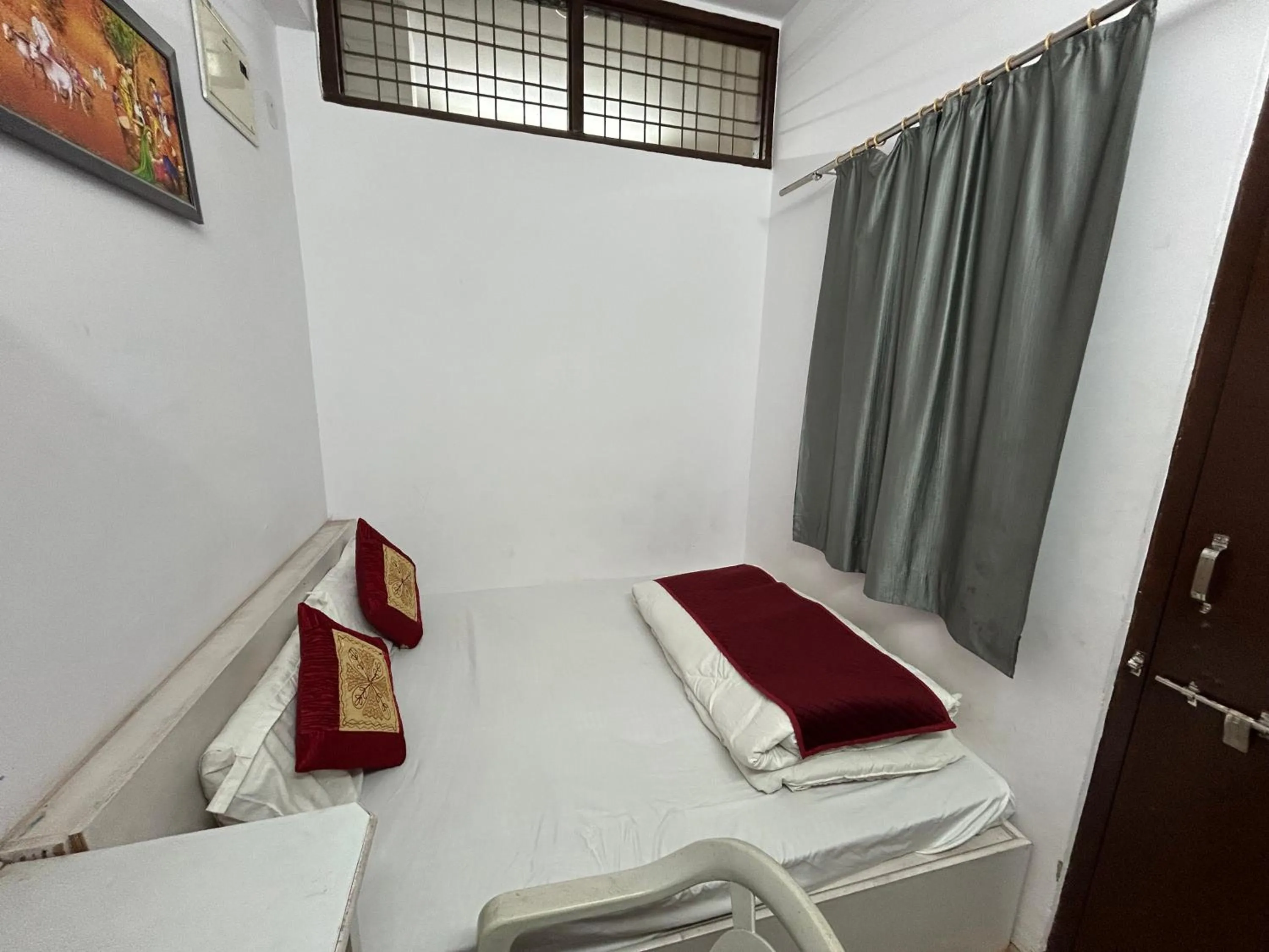 Bed in Ashish Guest House, Udaipole