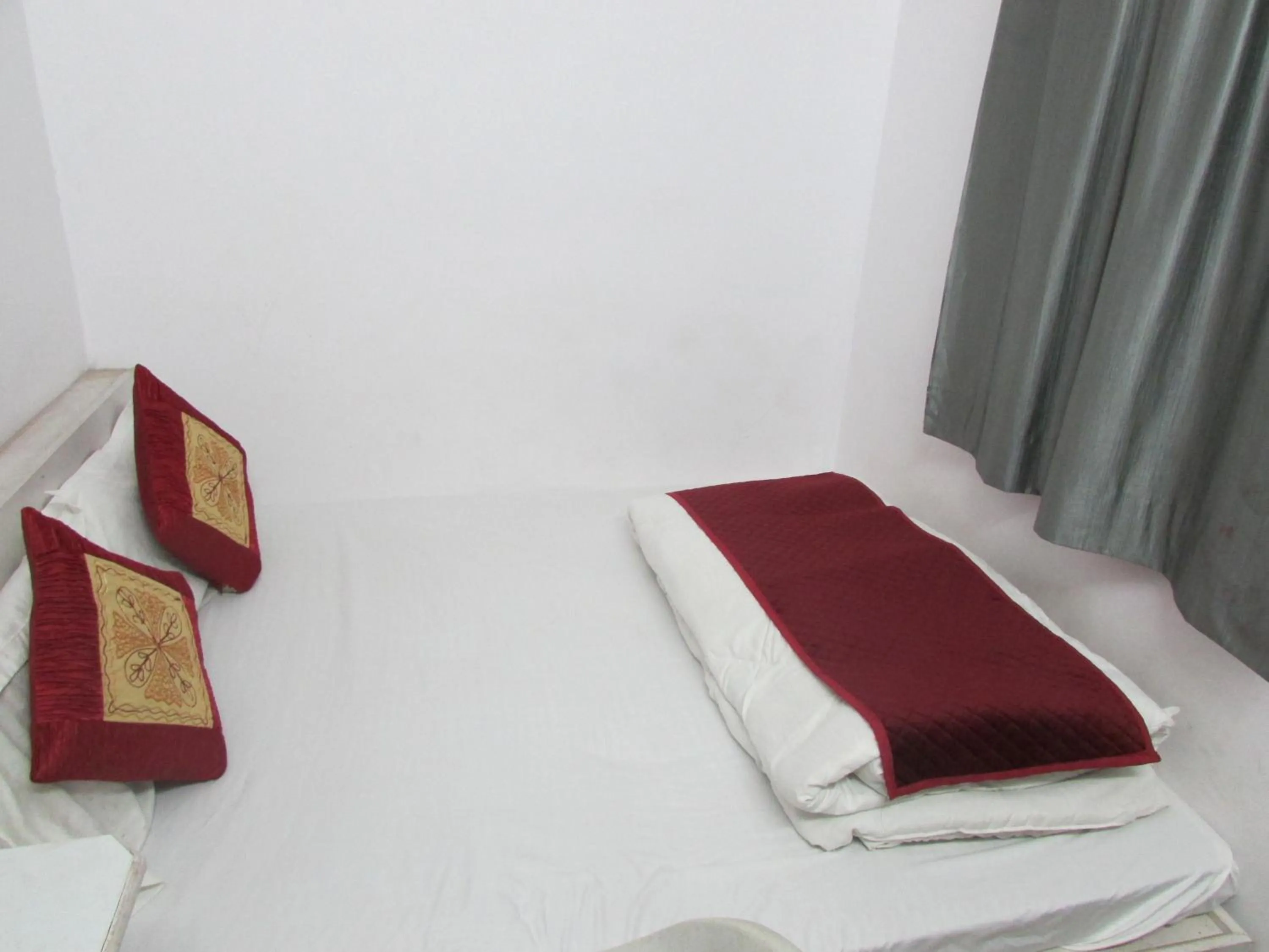 Bed in Ashish Guest House, Udaipole