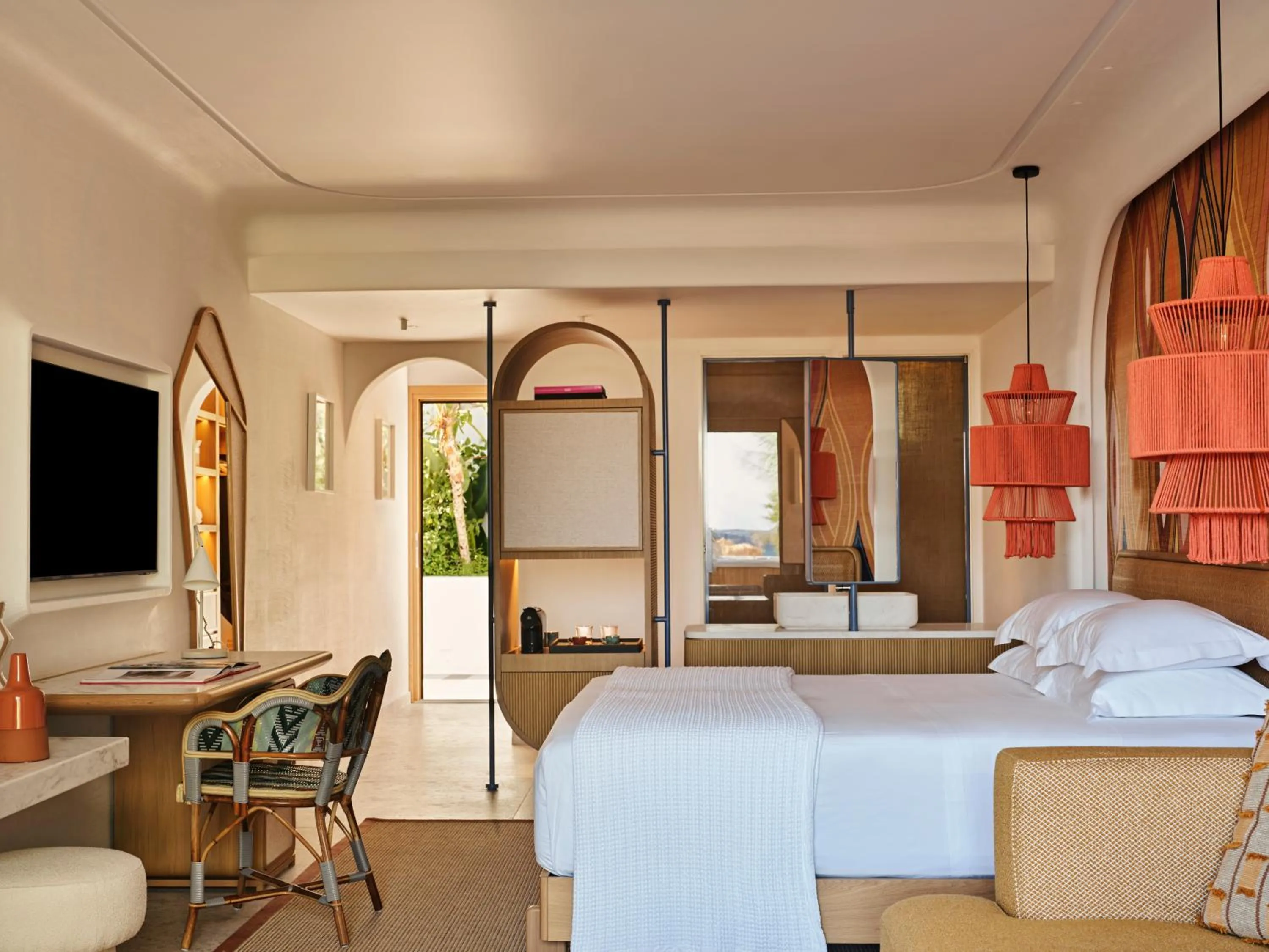 Bed in Myconian Sunrise Relais & Chateaux Hotel