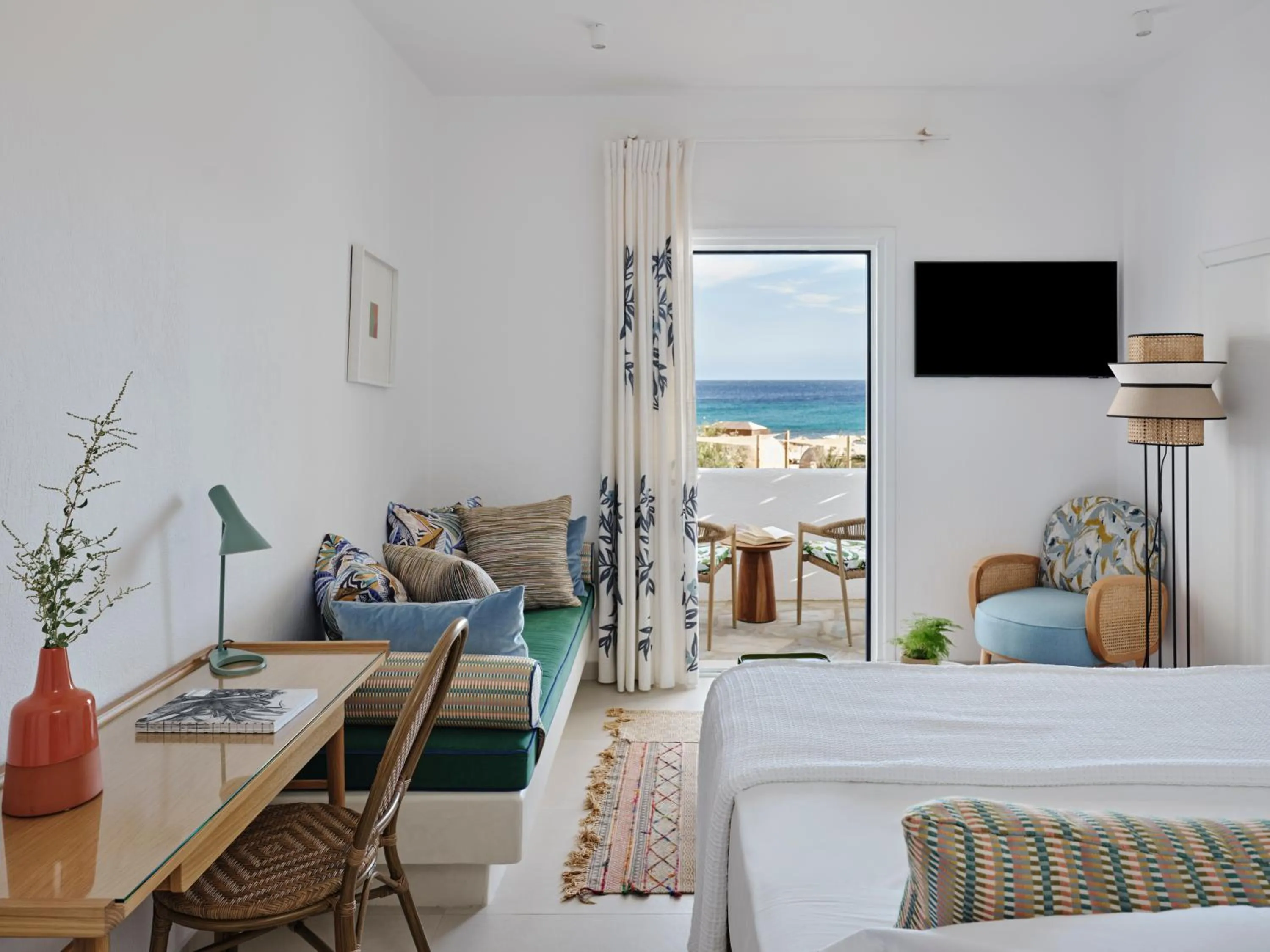 Bed in Myconian Sunrise Relais & Chateaux Hotel