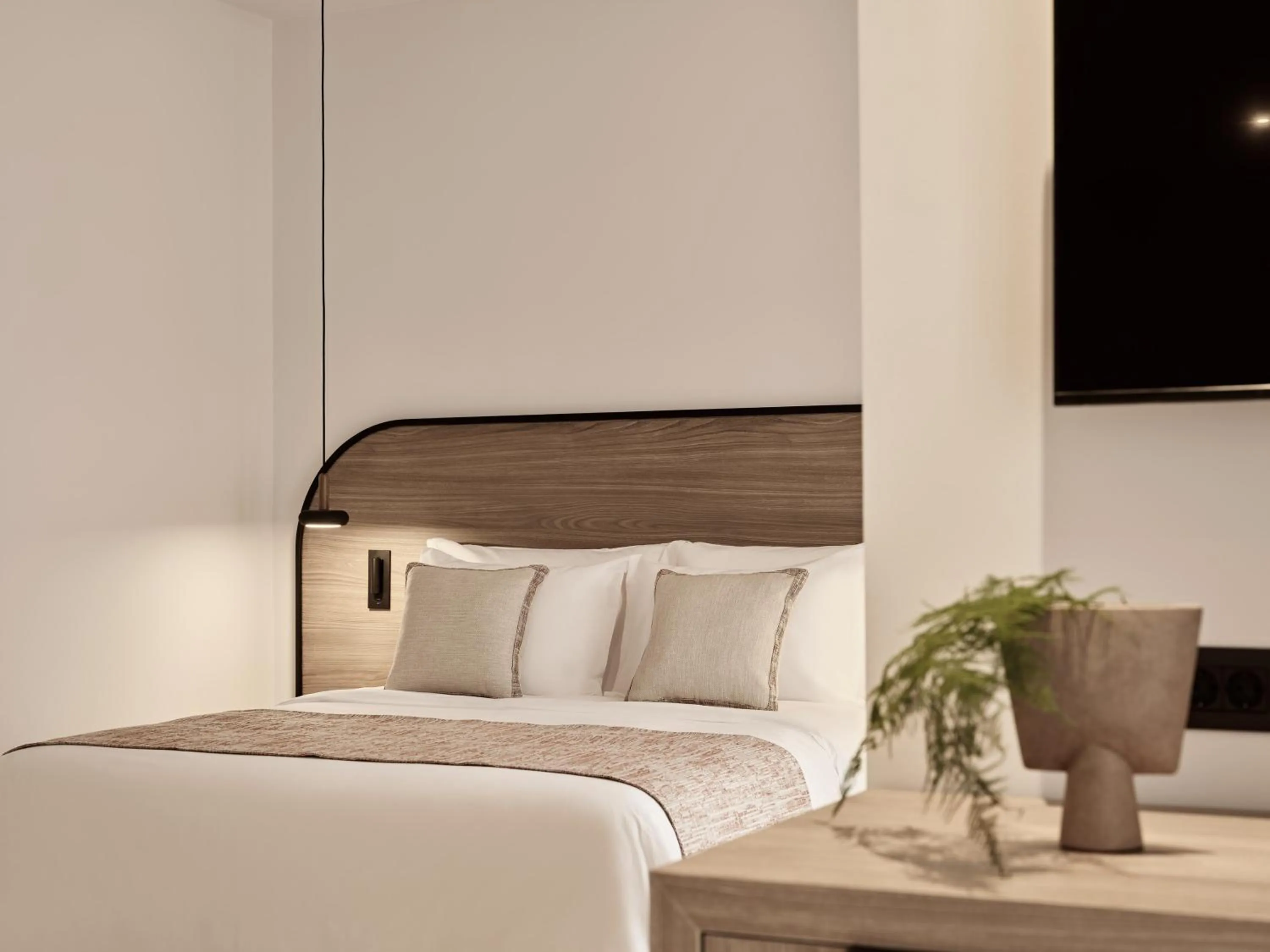 Bed in NAUMA PAROS Design Boutique Hotel