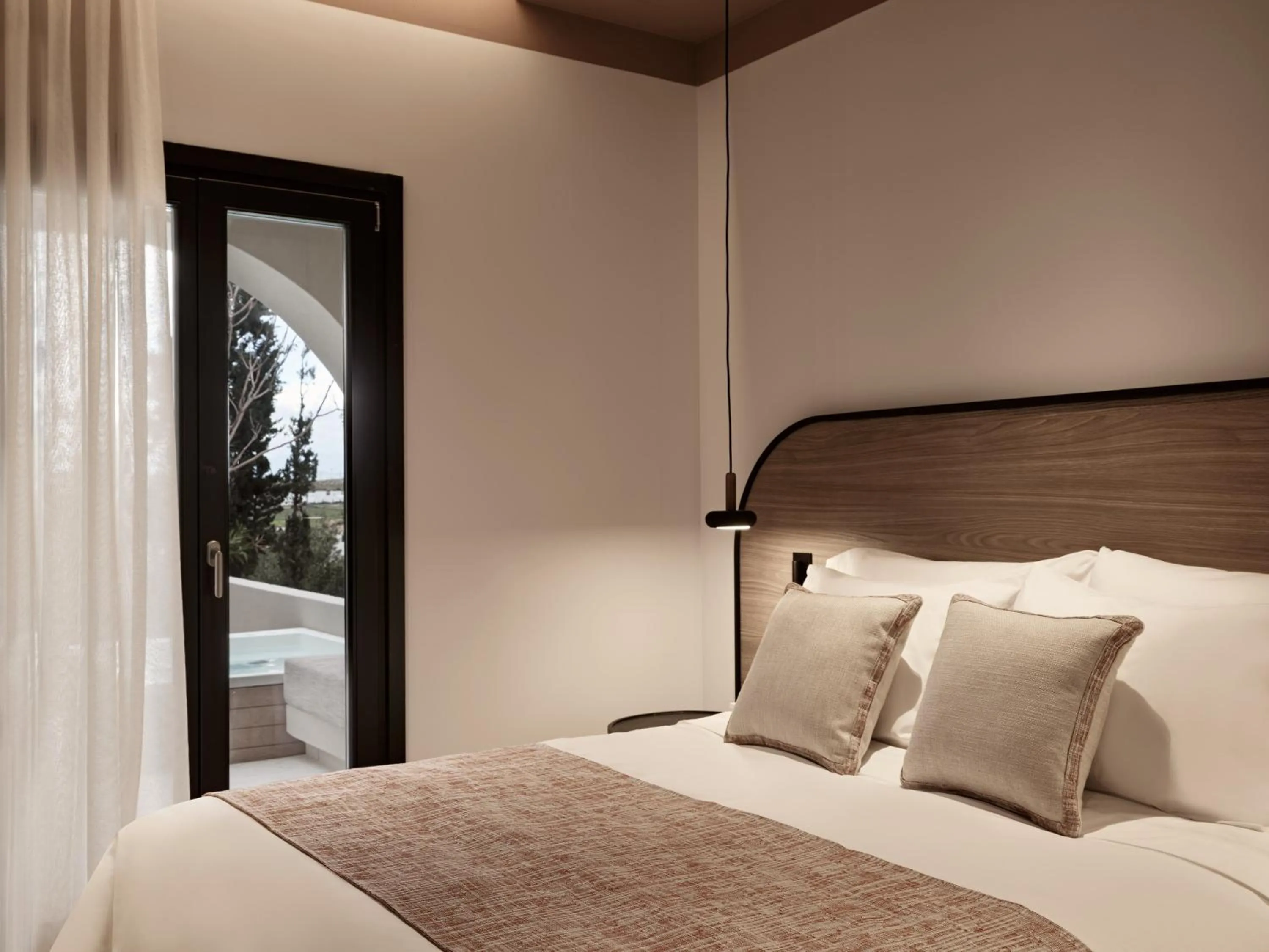 Bed in NAUMA PAROS Design Boutique Hotel