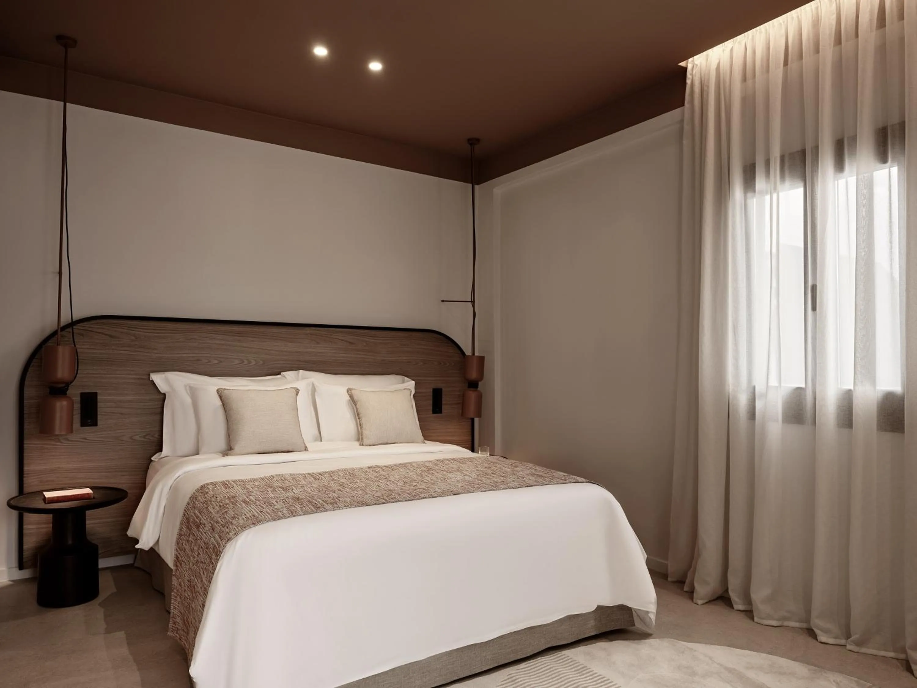 Bed in NAUMA PAROS Design Boutique Hotel