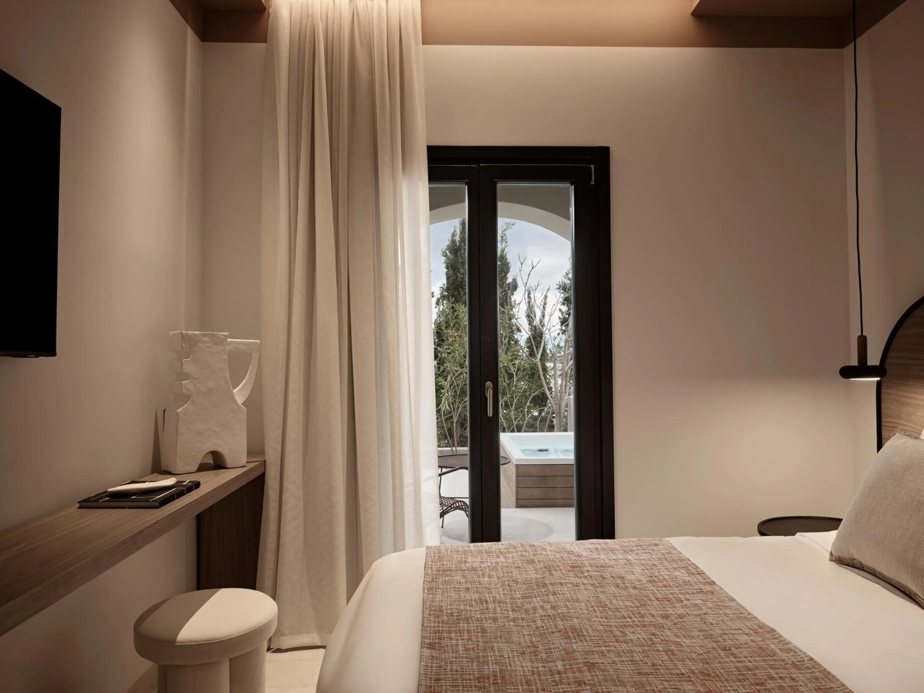 Bed in NAUMA PAROS Design Boutique Hotel
