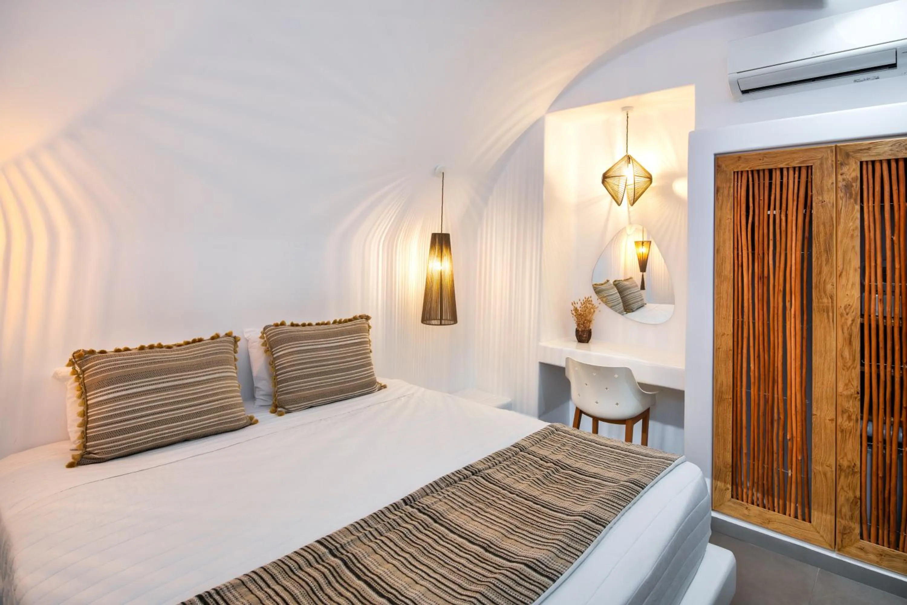 Bed in Evgenia Villas & Suites by Calm Collection