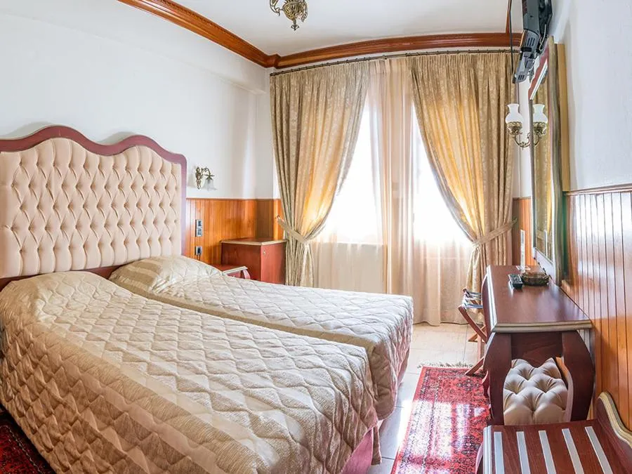 Bed in Hotel Apollon