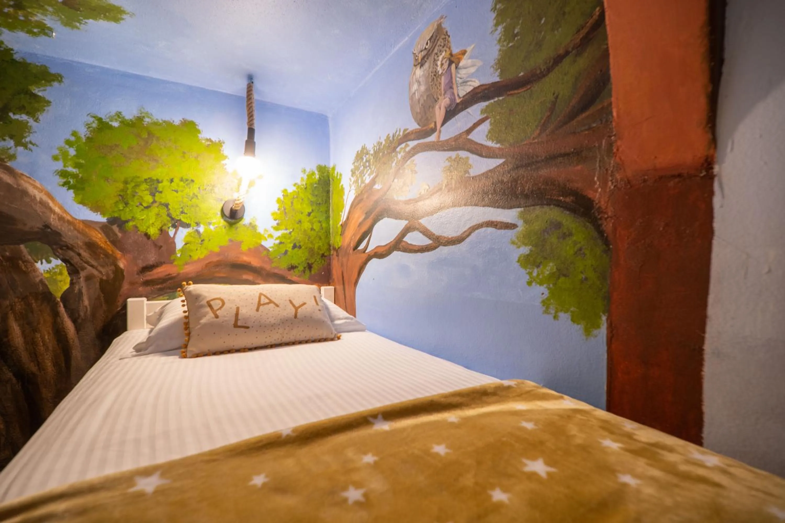 Bed in Paradisio Baby & Kinder Apartments