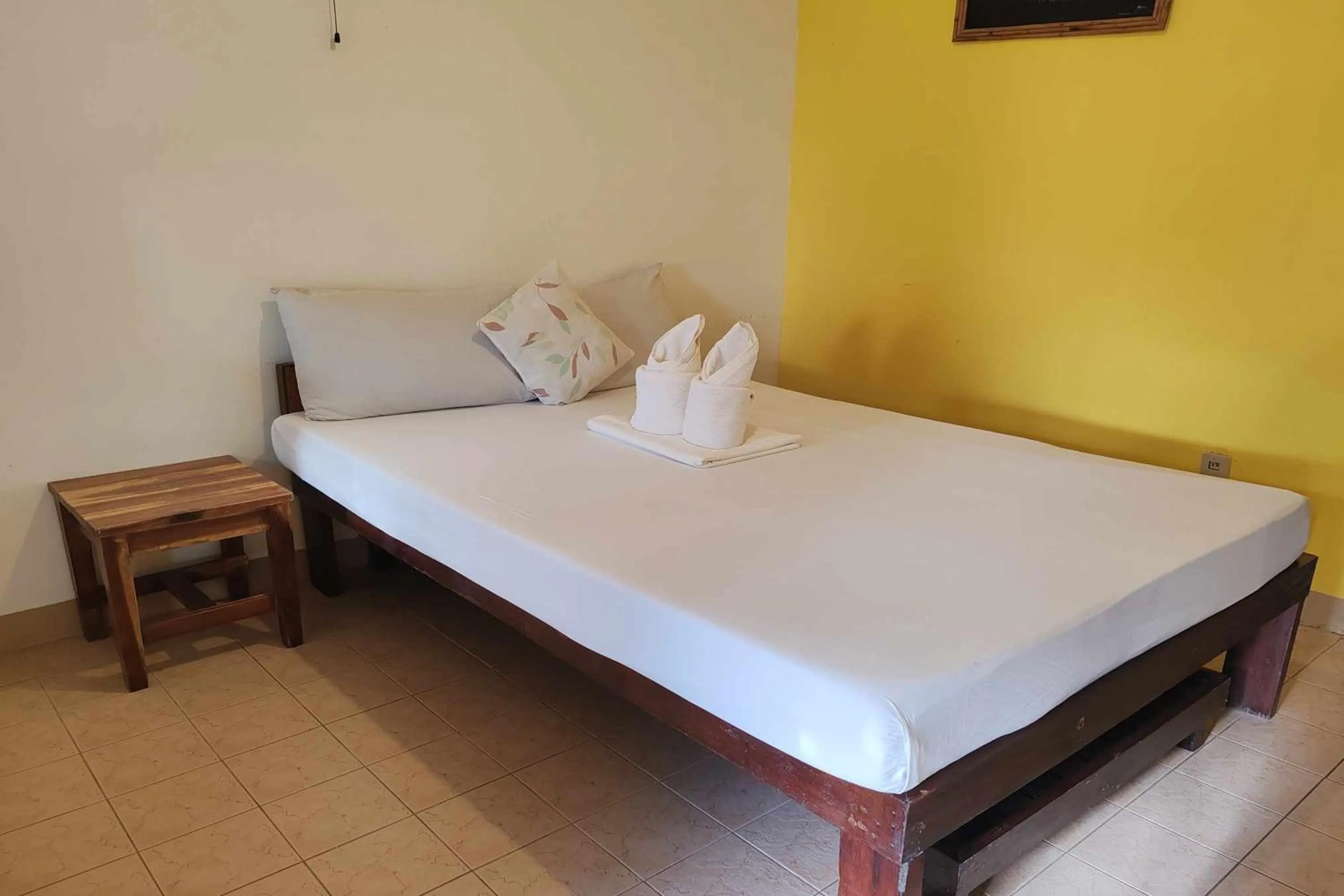 Bed in Summer Homes Beach Front Resort and Cottages Port Barton