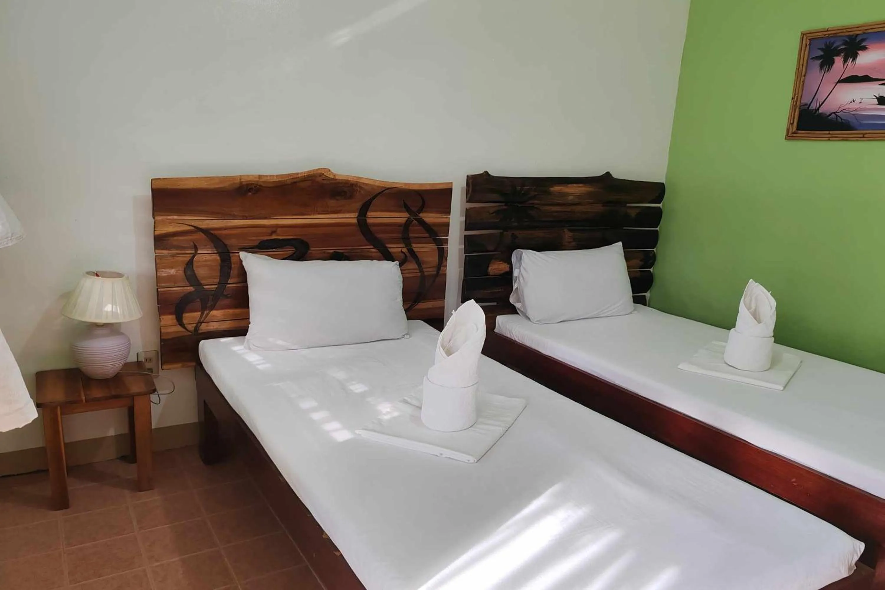 Bed in Summer Homes Beach Front Resort and Cottages Port Barton