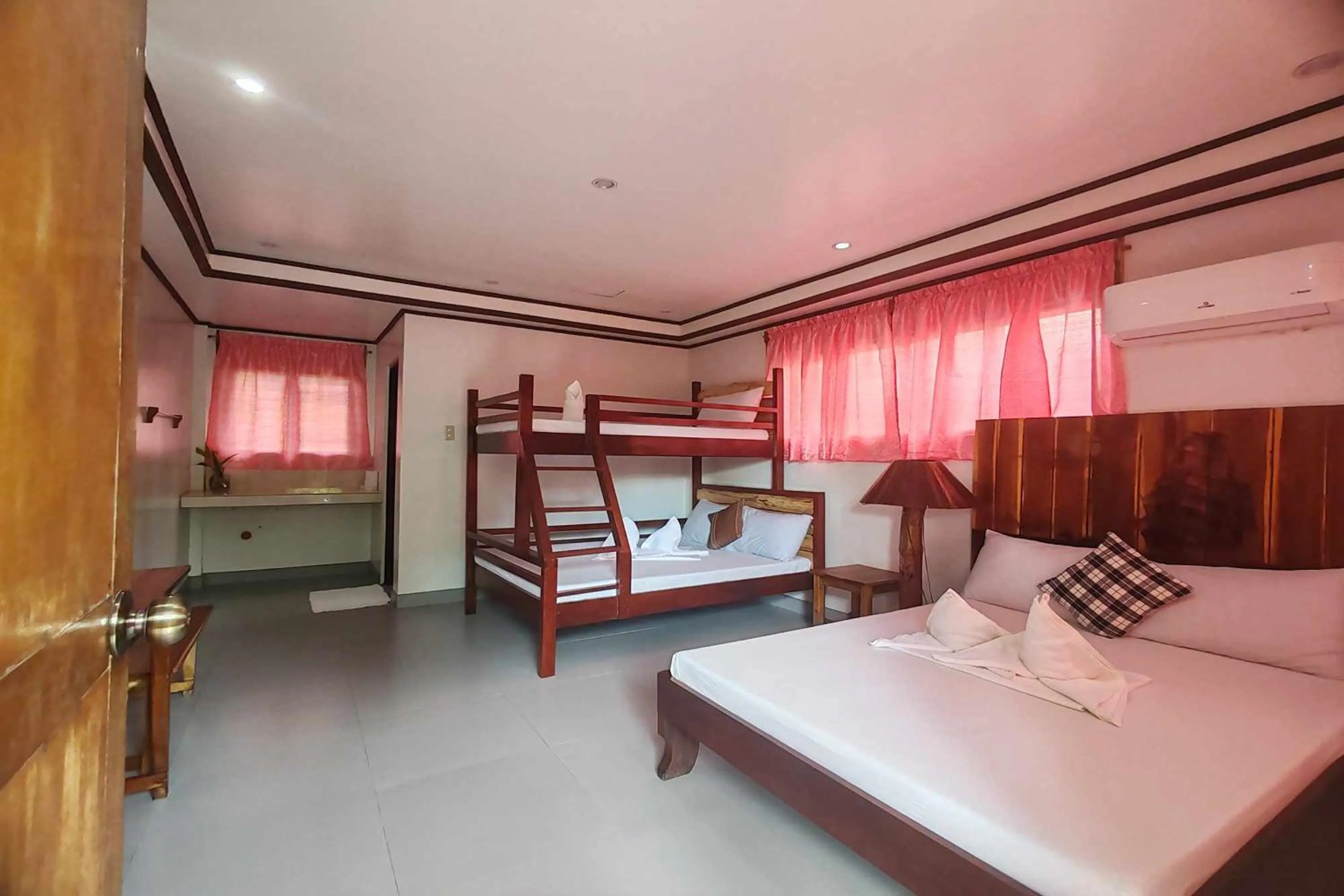 Bed in Summer Homes Beach Front Resort and Cottages Port Barton