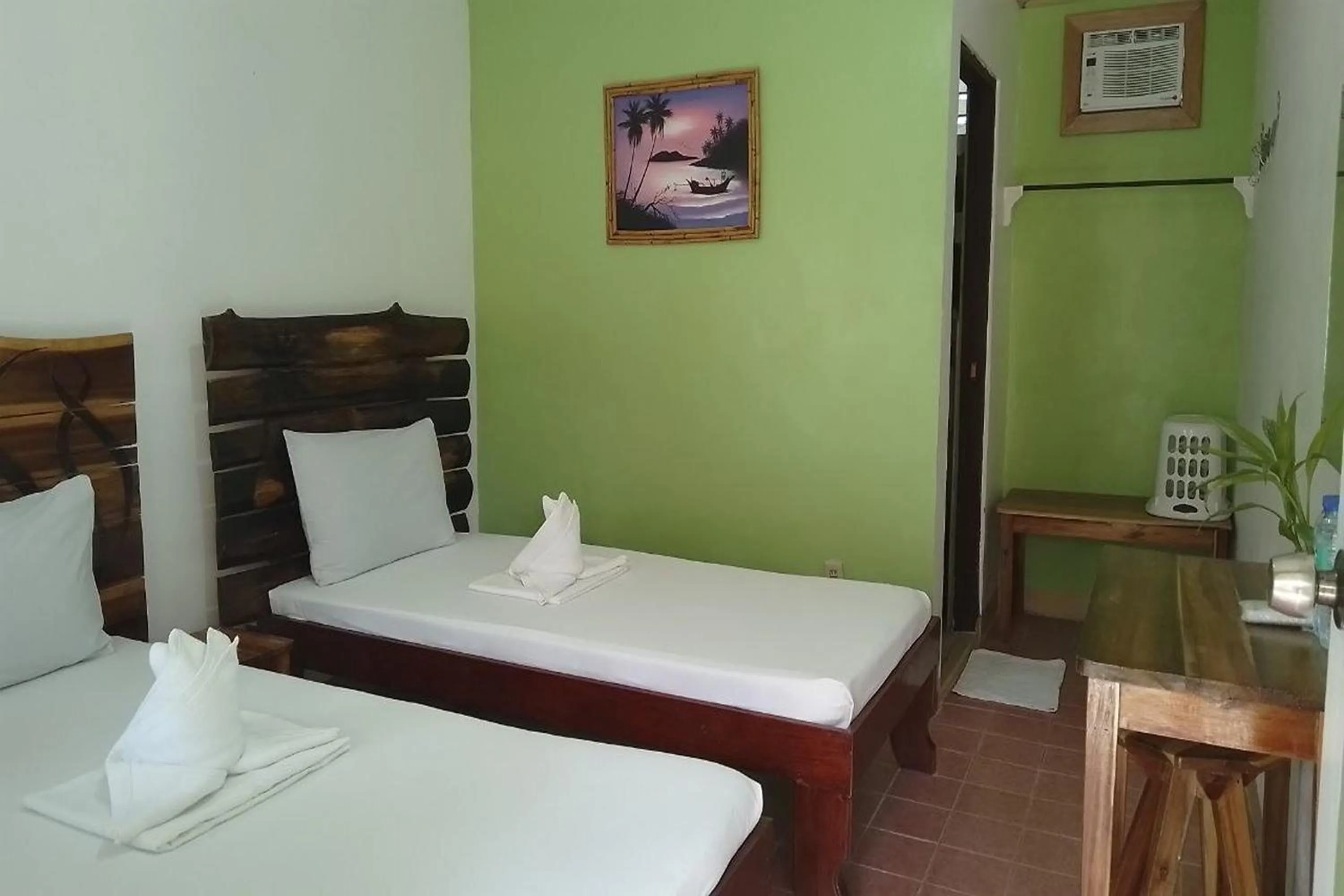 Bed in Summer Homes Beach Front Resort and Cottages Port Barton