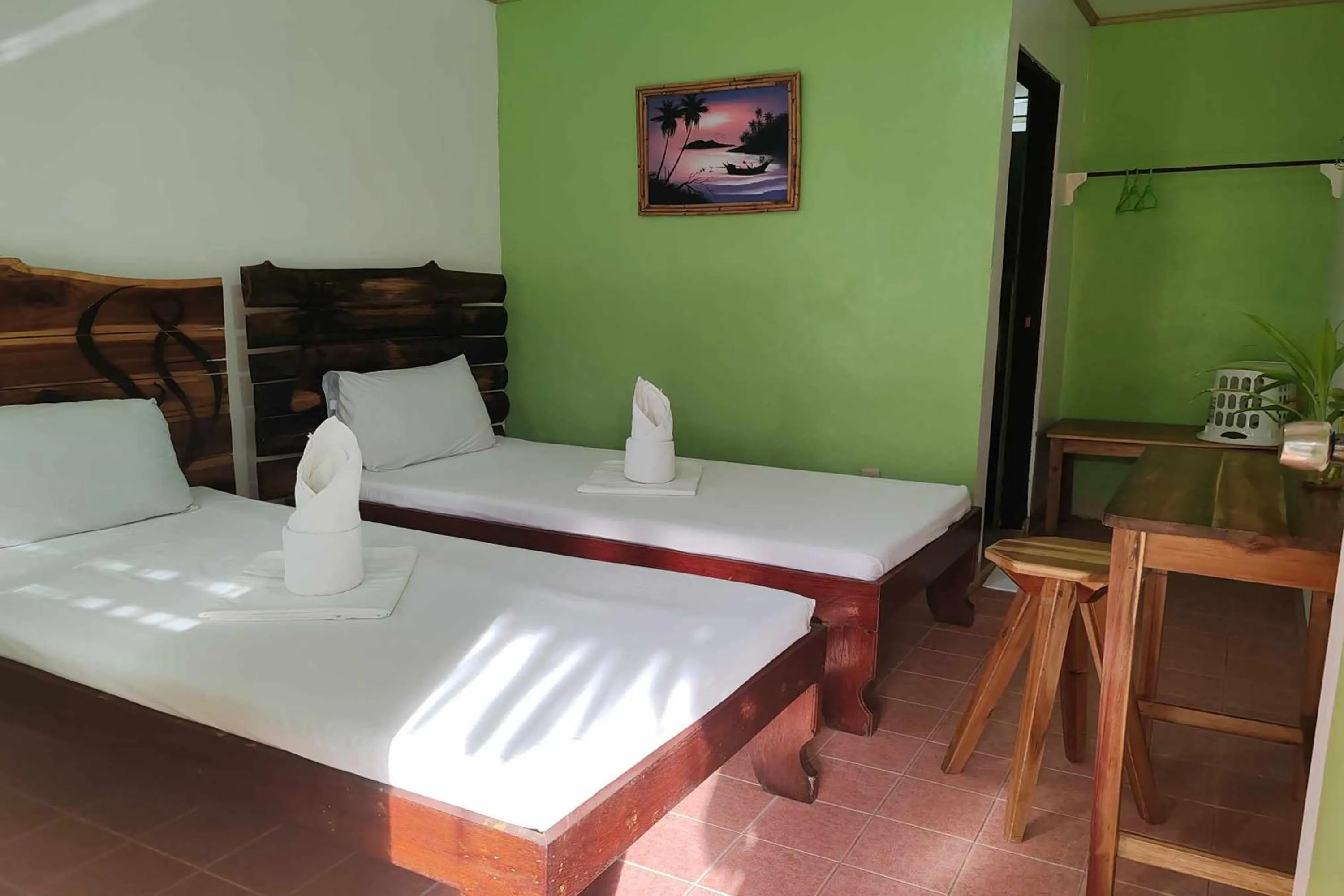 Bed in Summer Homes Beach Front Resort and Cottages Port Barton