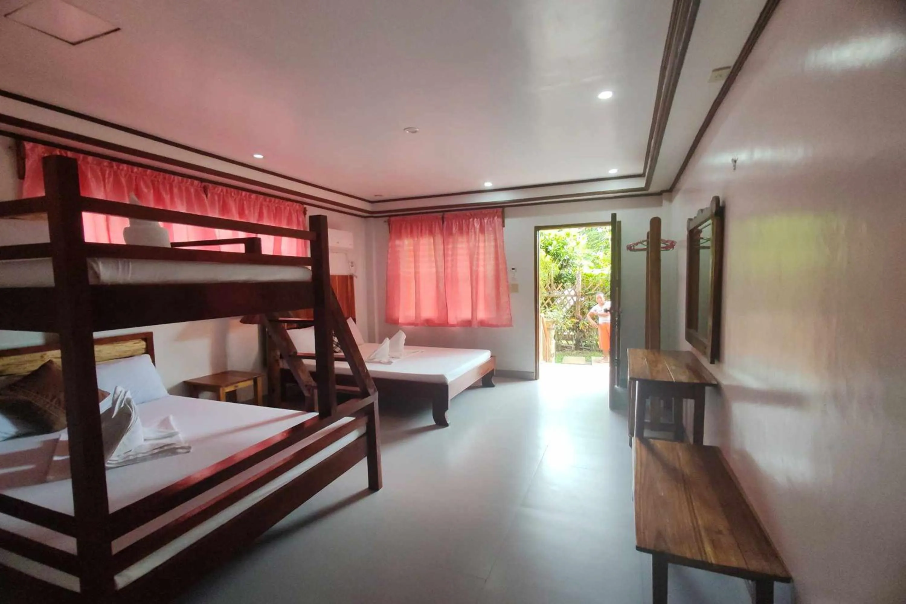 Bed in Summer Homes Beach Front Resort and Cottages Port Barton