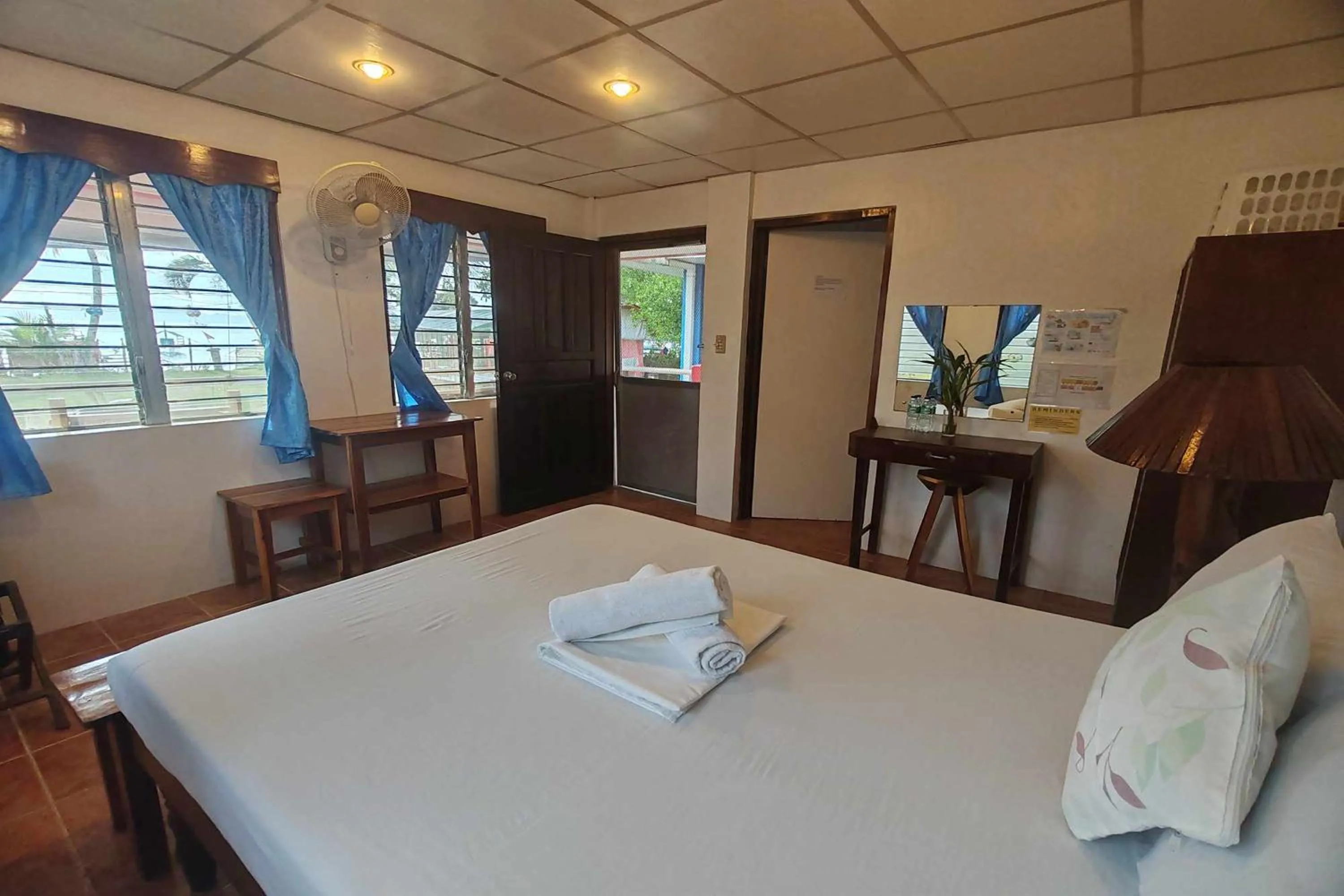 Bed in Summer Homes Beach Front Resort and Cottages Port Barton