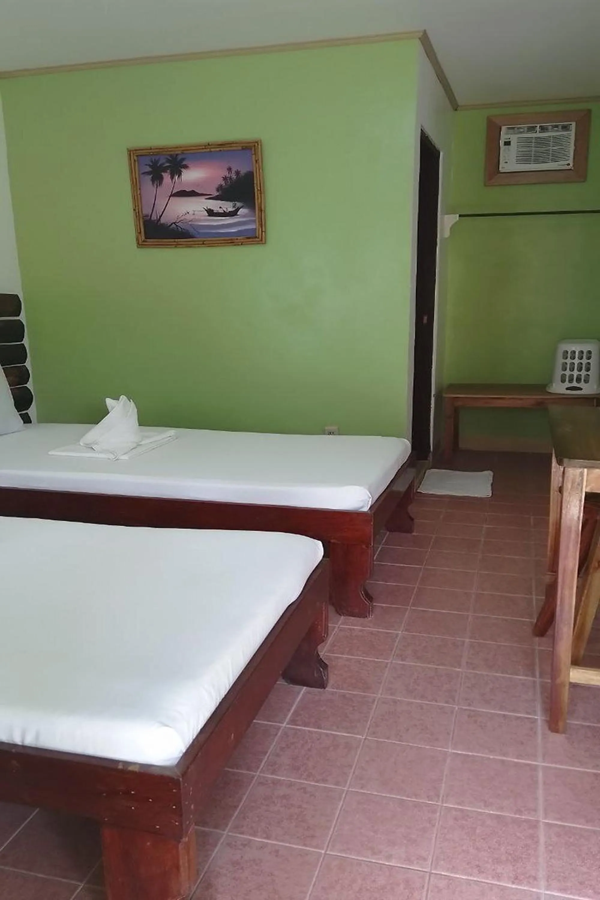 Bed in Summer Homes Beach Front Resort and Cottages Port Barton