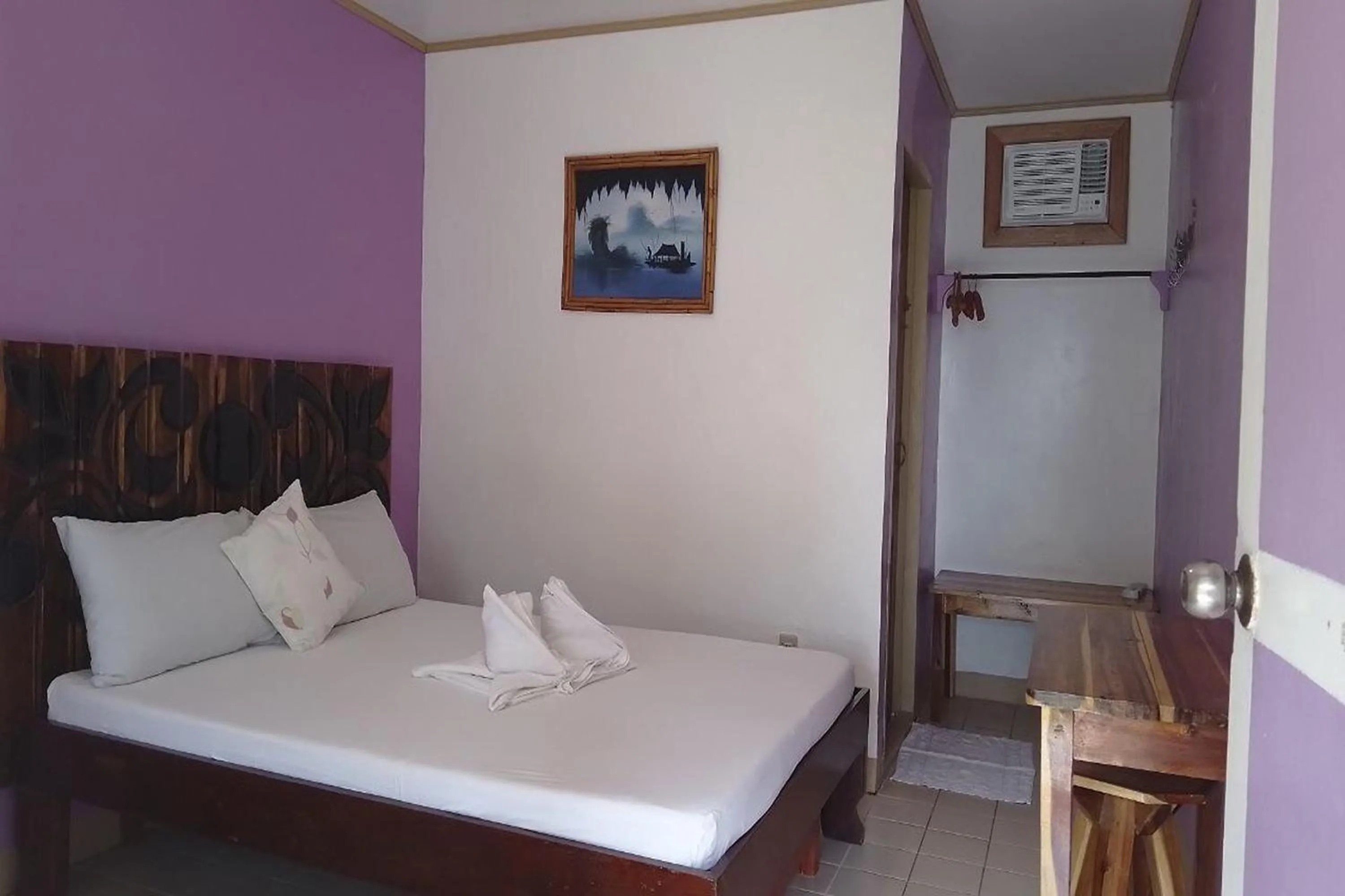 Bed in Summer Homes Beach Front Resort and Cottages Port Barton