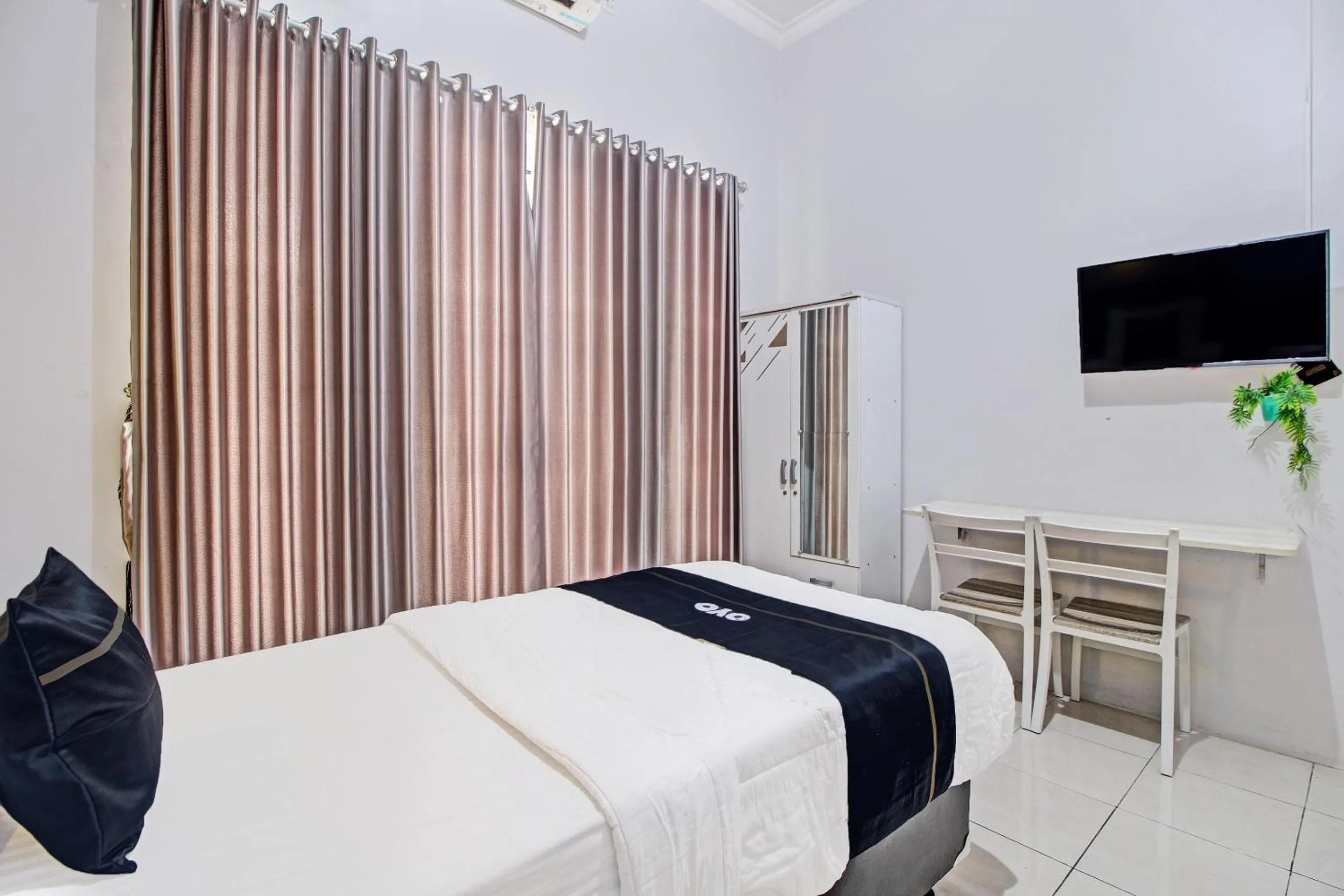 Bedroom in Capital O 92250 Hall & Guesthouse Kowapi Syariah