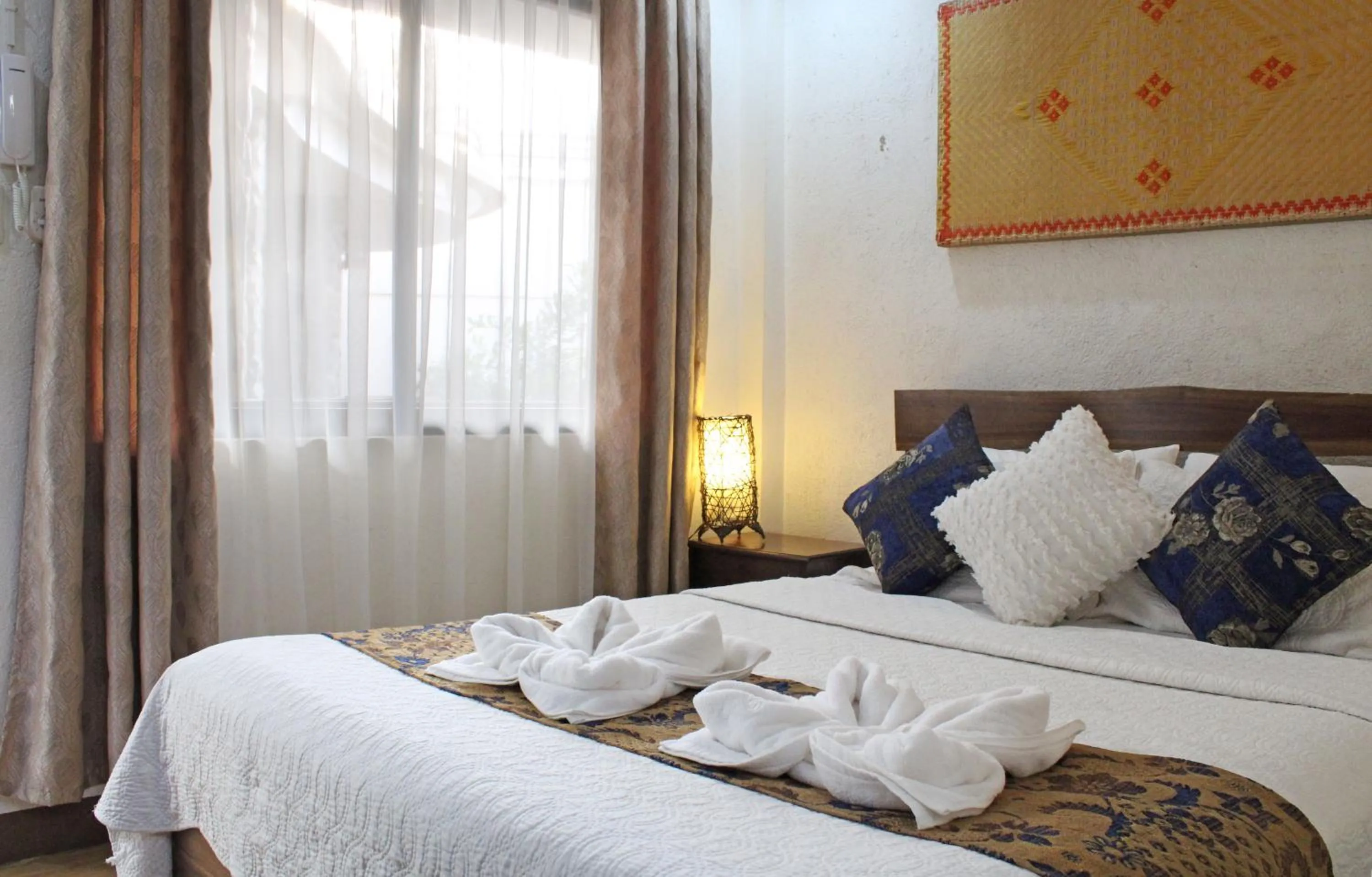 Bed in Balaibinda Lodge