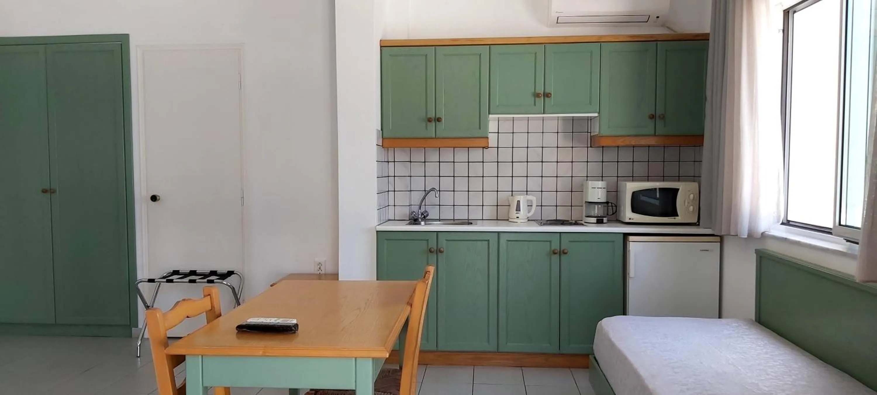 Kitchen or kitchenette in Andromeda Hotel Apartments