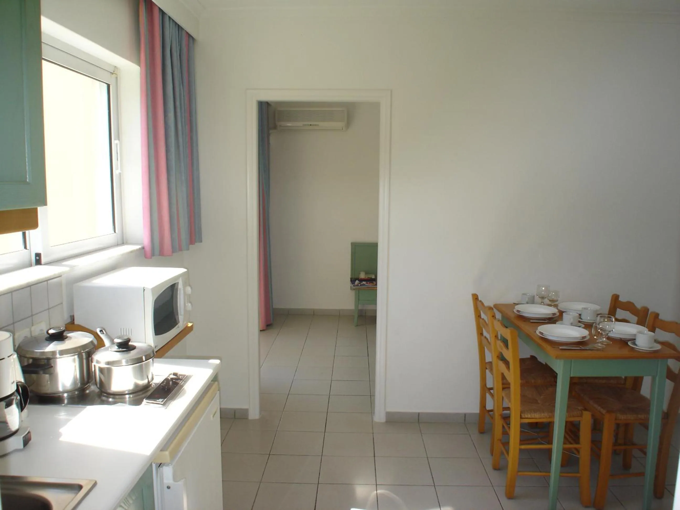Kitchen or kitchenette in Andromeda Hotel Apartments