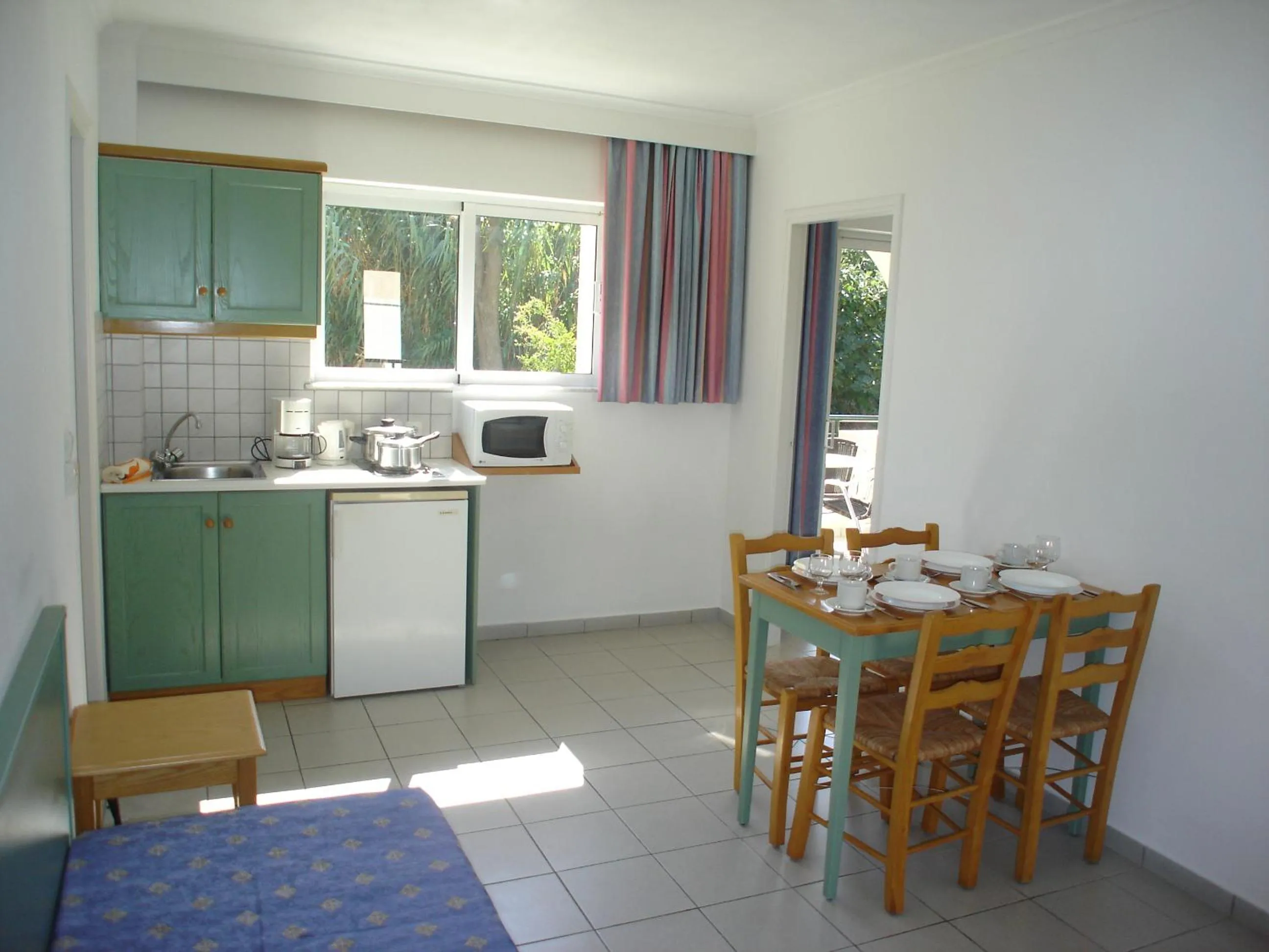 Kitchen or kitchenette in Andromeda Hotel Apartments