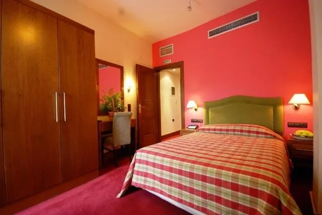 Bed in Hotel Elvetia