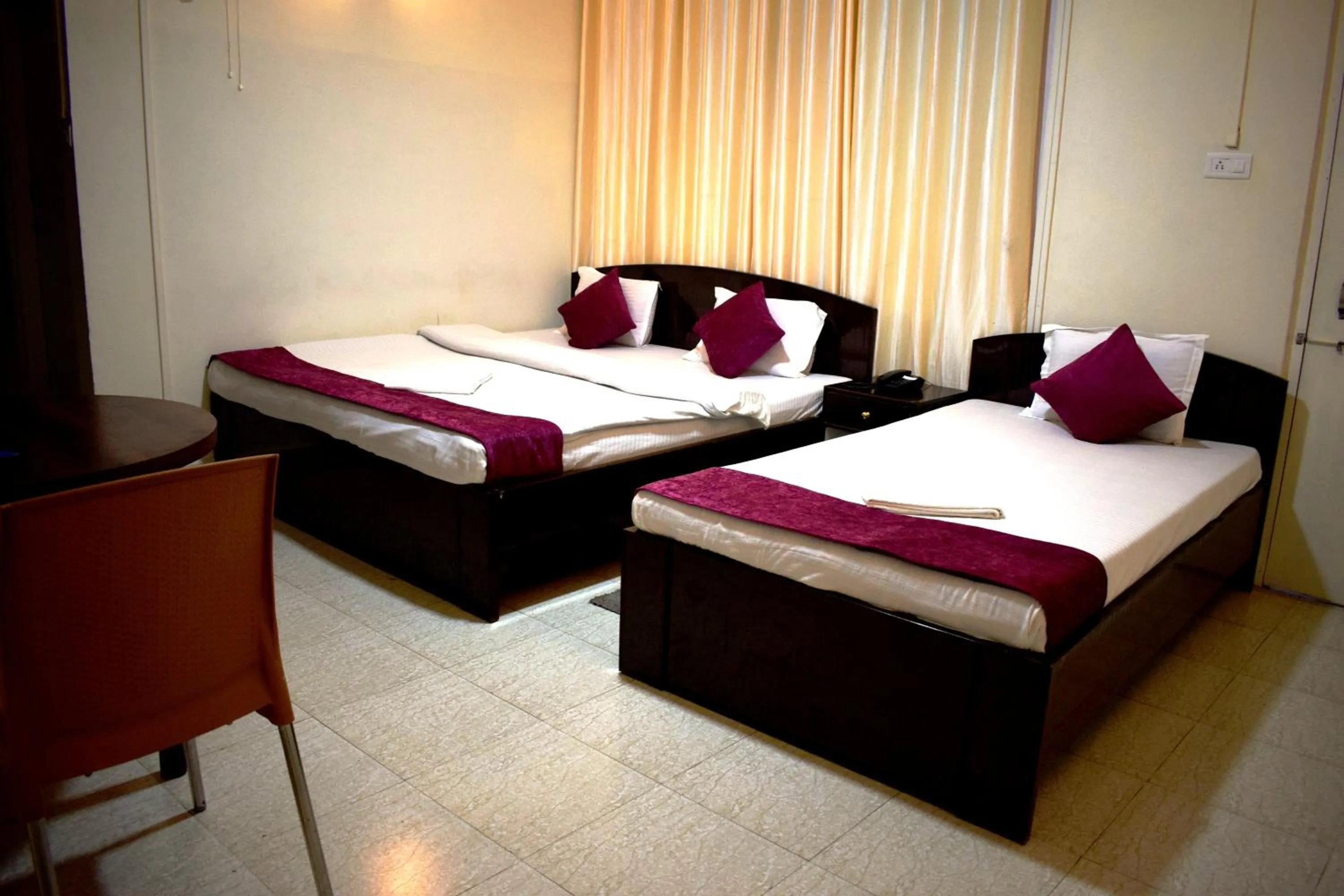 Bed in LILY GUEST HOUSE