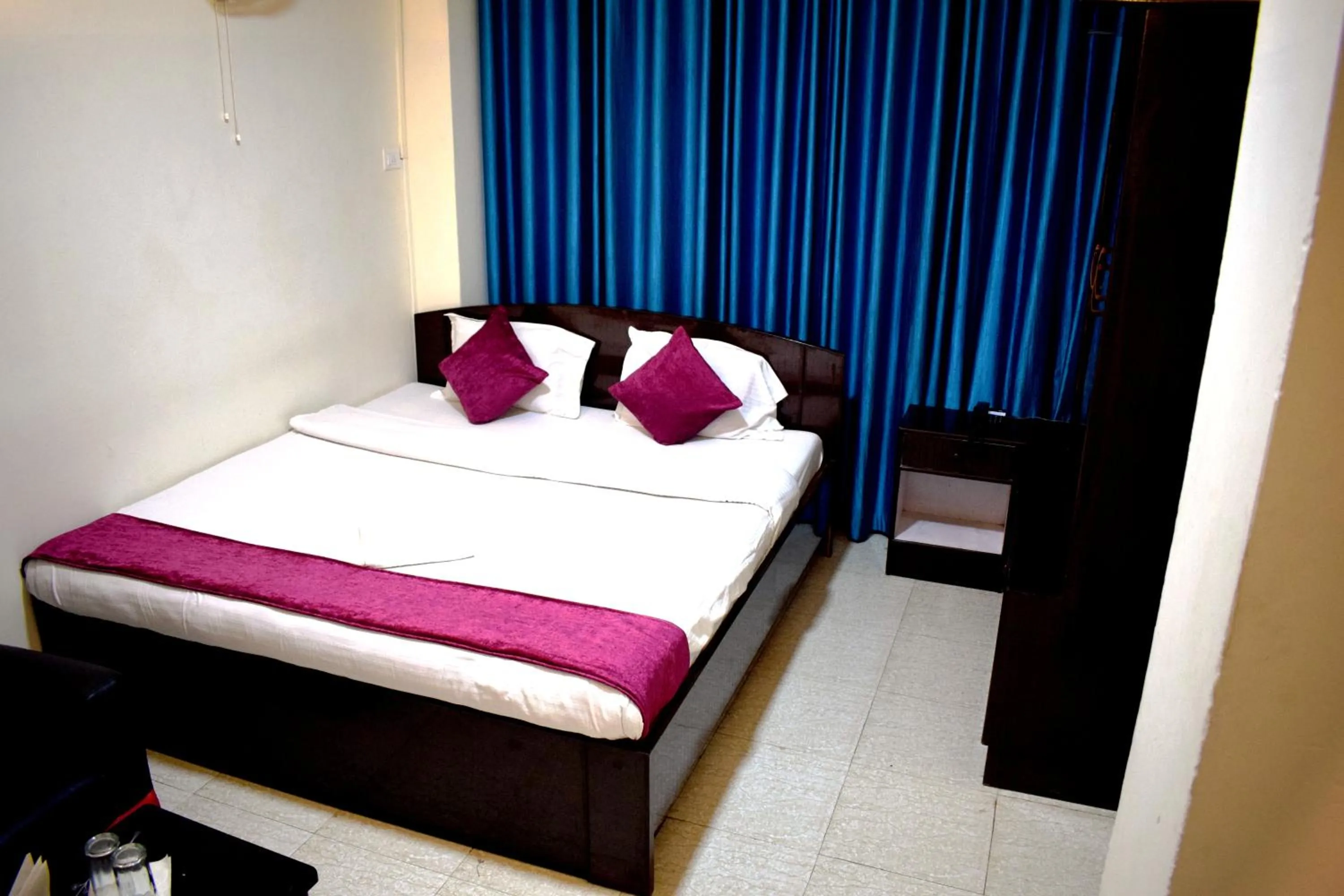 Bed in LILY GUEST HOUSE