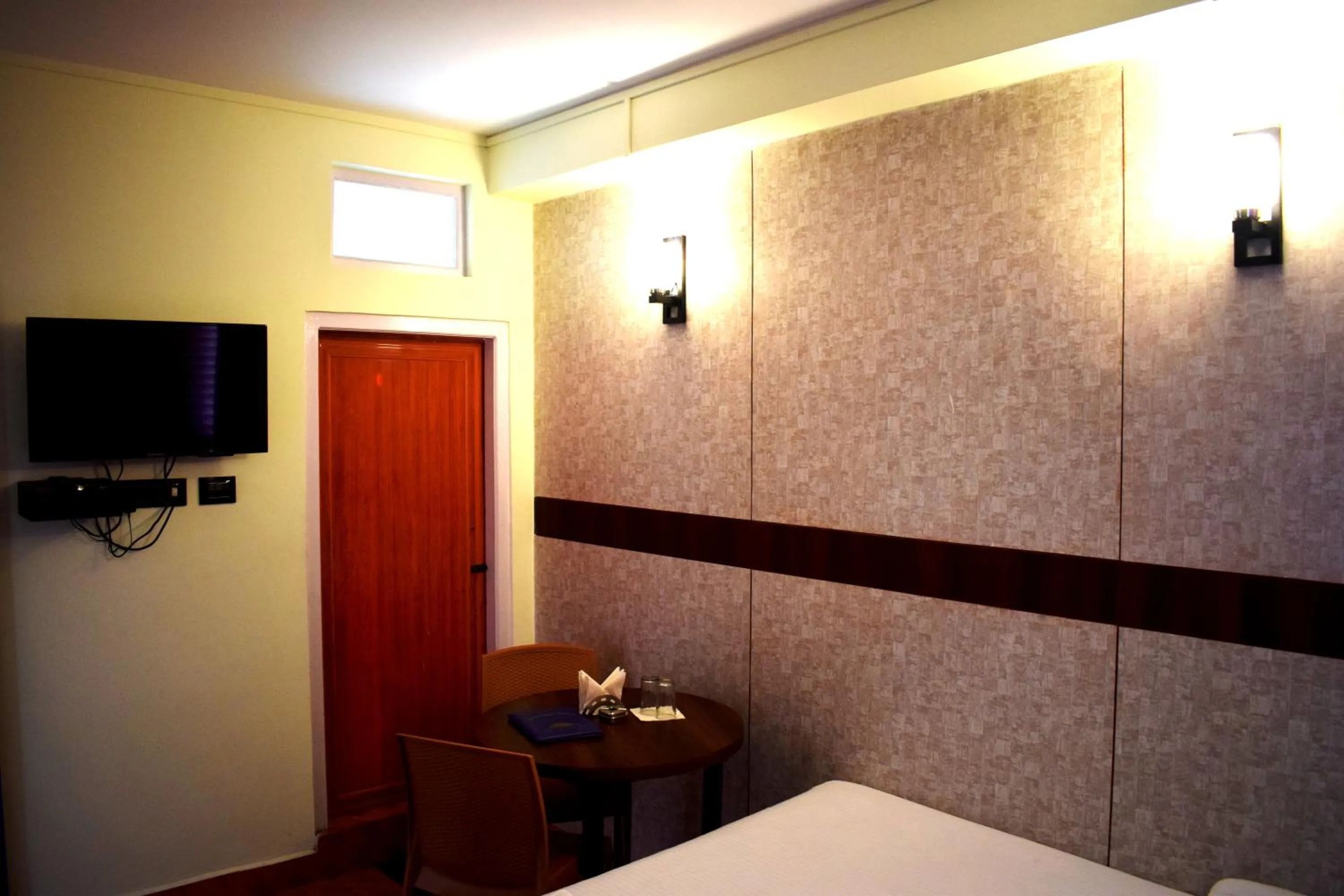 Bed in LILY GUEST HOUSE