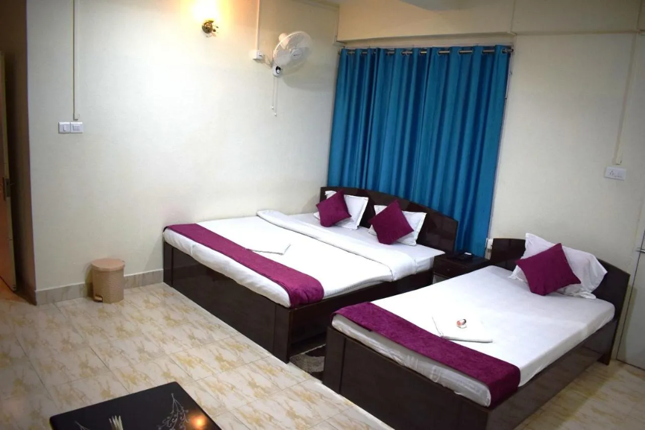 Bed in LILY GUEST HOUSE