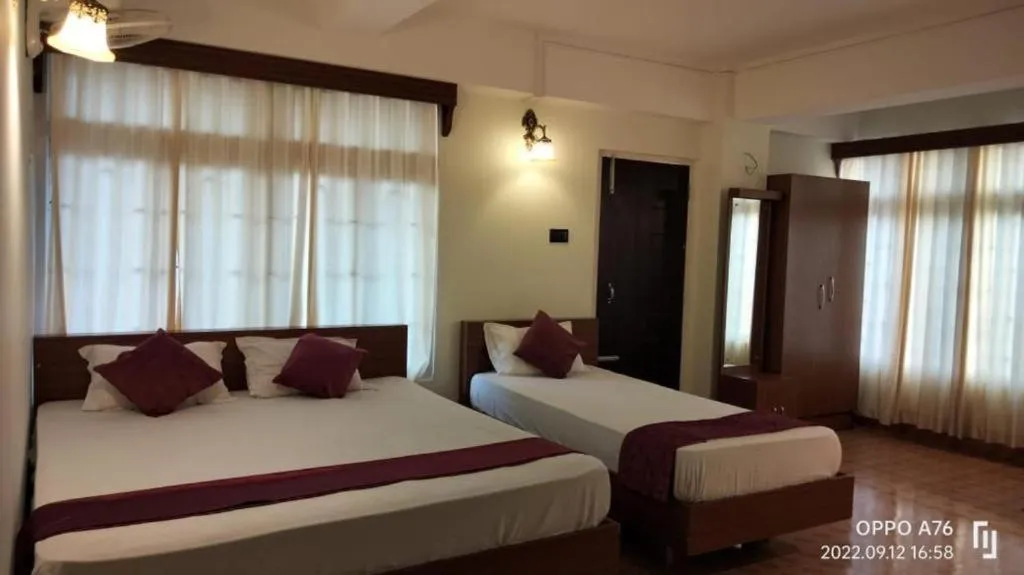 Bed in LILY GUEST HOUSE