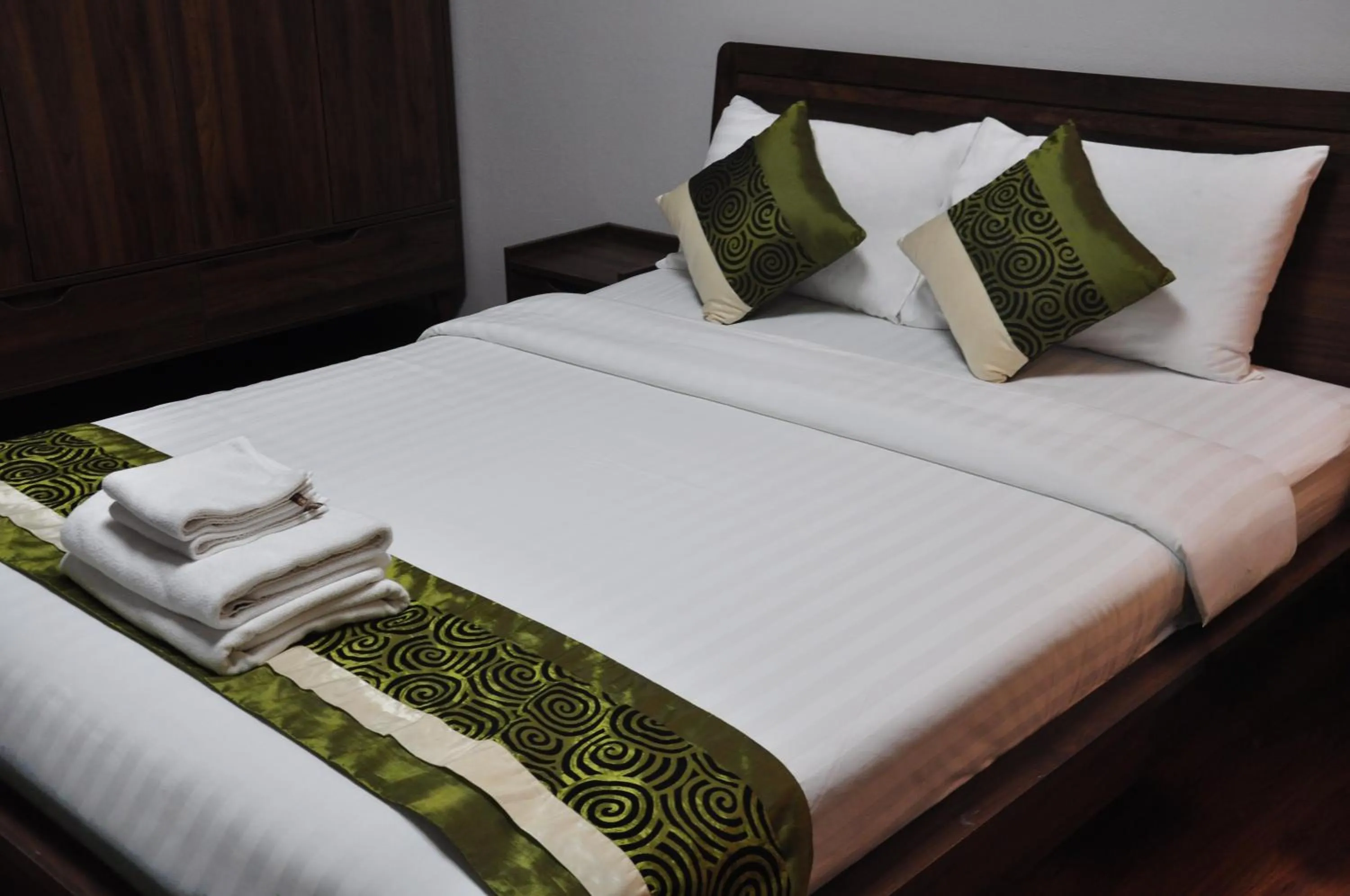 Bed in The Bedrooms Maeklong and Services Apartment