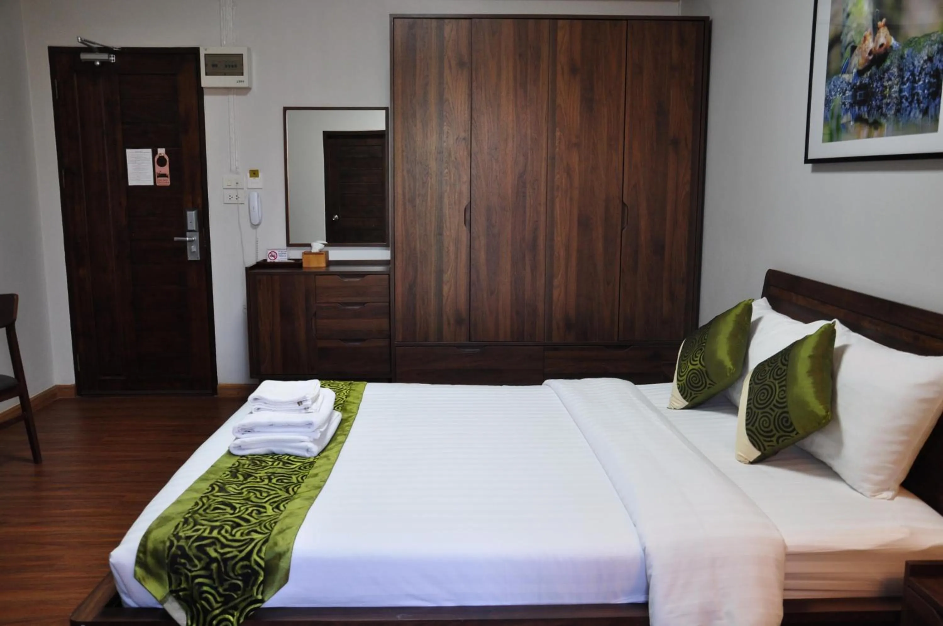 Bed in The Bedrooms Maeklong and Services Apartment