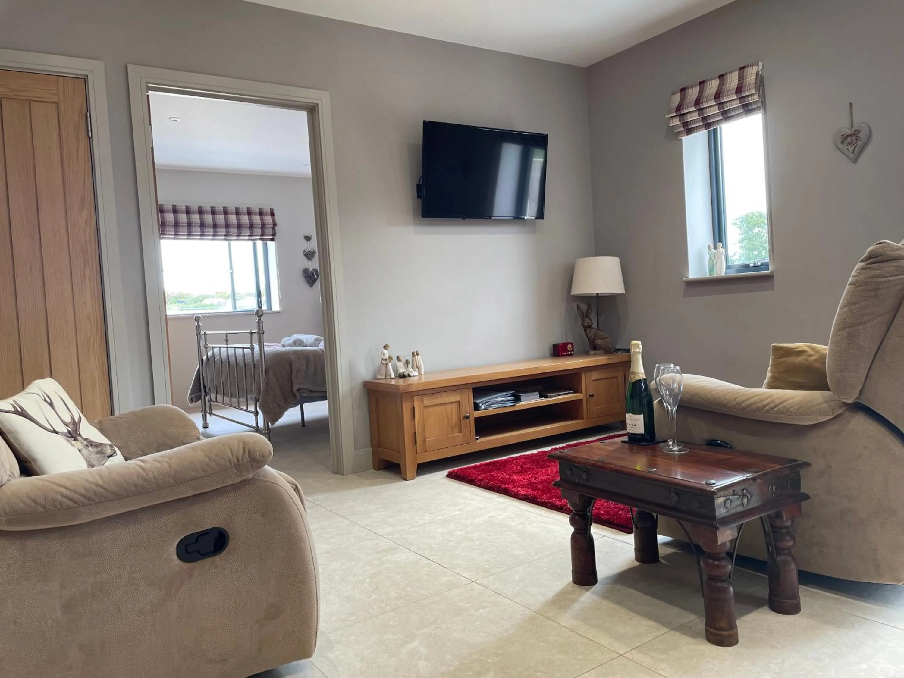 Living room in The Paddocks - Spacious annexe with rural outlook.