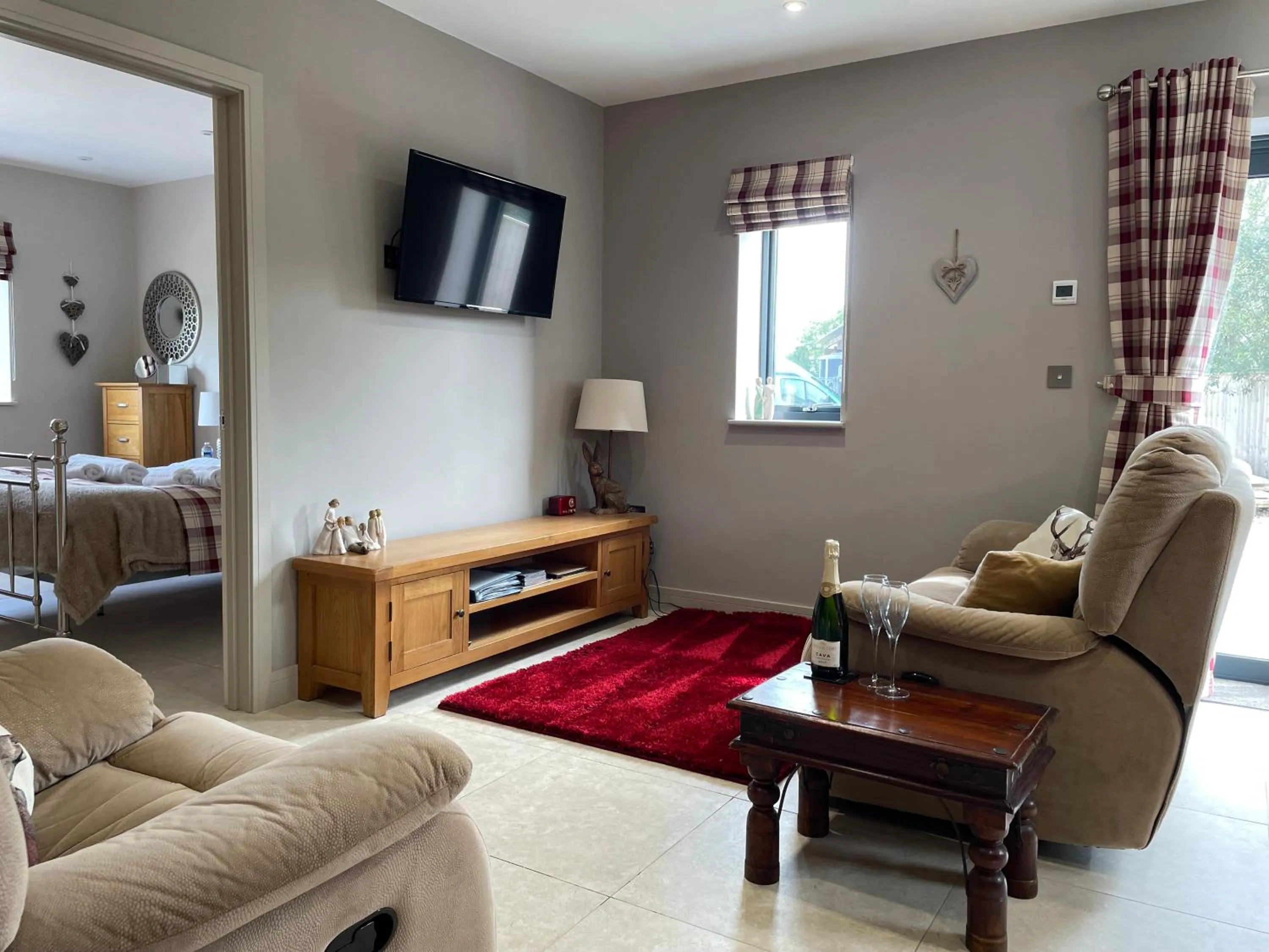 Living room in The Paddocks - Spacious annexe with rural outlook.
