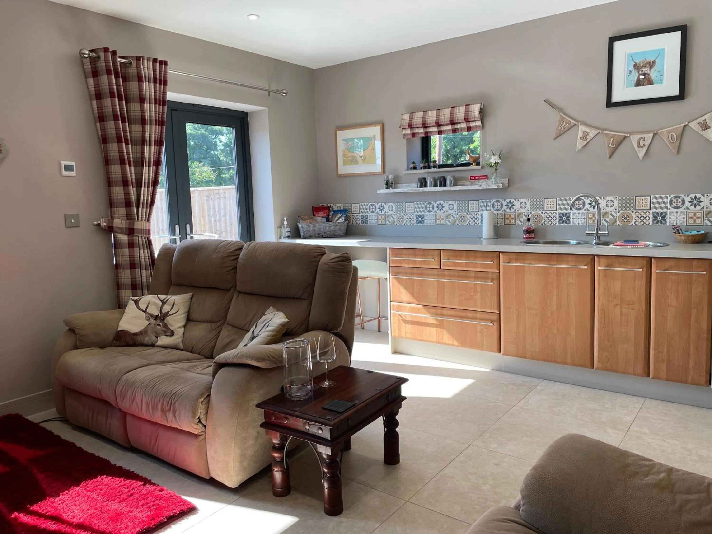 Living room in The Paddocks - Spacious annexe with rural outlook.